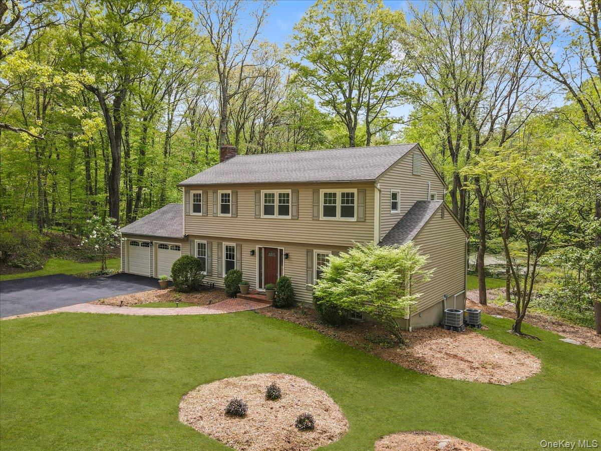 This move-in ready colonial offers a functional layout for everyday living and entertaining, in a serene setting. The home’s orientation provides leafy views of the woodsy property, pond, and old stone walls. On the main floor, there is a newly updated eat-in kitchen, a large family room with a cozy fireplace, large living and dining rooms, outdoor space on the deck, and access to a two-car garage (with room for a workshop!). Upstairs are four quiet bedrooms and two baths, including a primary bedroom with its own bathroom and walk-in closet. Hardwood floors? Yes! The partially finished lower level has walk-out access to the back yard as well as a large mechanical room and storage area. New highly-efficient heat pumps provide forced air heating and cooling. An oil-based furnace provides hot water and additional hybrid heating capacity when needed.Silvermine Drive is a cul-de-sac with two nature preserves, making it ideal for walking, interacting with neighbors, and enjoying the environment. This home is located within the Katonah-Lewisboro school district (Meadow Pond Elementary/John Jay Middle and High Schools). Residents enjoy all of Lewisboro’s open spaces, town facilities, and programming, including nearby Onatru Farm Park, with a playground, trails for short runs or long walks, and an active community garden. Other nearby open spaces include Leon Levy Preserve, Grace Farms, and Woodcock Nature Center. Ridgefield and New Canaan town centers offer shopping, dining, and activities. For commuters, there is easy access to Norwalk and Stamford, and direct one-seat commuter service to Grand Central via MetroNorth from both Wilton and New Canaan.