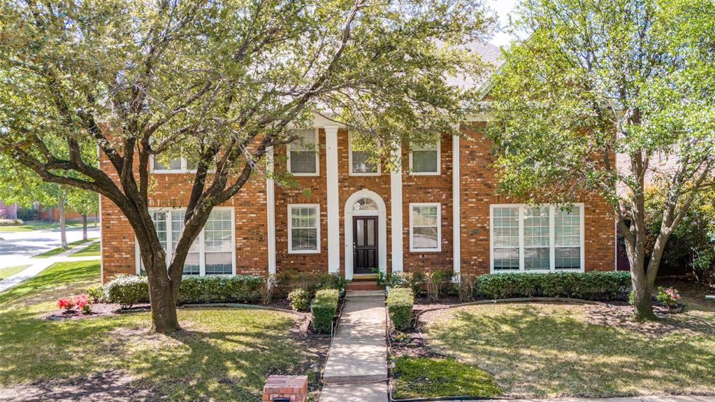 Welcome to this stunning corner-lot home in the exclusive gated community of Hackberry Creek. Surrounded by mature trees and lush landscaping, this unique estate offers both elegance and comfort. Step into a dramatic two-story foyer featuring a grand staircase and detailed crown molding throughout the main level. The beautifully updated kitchen boasts granite countertops, double ovens, and a cozy breakfast nook—perfect for casual mornings or entertaining. Unwind in the formal living room by the wood-burning fireplace or retreat to the luxurious primary suite with a spa-like bath, including a jetted tub, walk-in shower, dual vanities, and generous storage.
Upstairs, you’ll find a spacious secondary living area, four oversized bedrooms, and two full bathrooms—ideal for family or guests. A dedicated home office and inviting back patio add to the functionality and charm of this well-designed floor plan. Enjoy convenient access to top shopping, dining, golf courses, entertainment, and DFW Airport—all just minutes away. This home offers the perfect blend of privacy, comfort, and location.