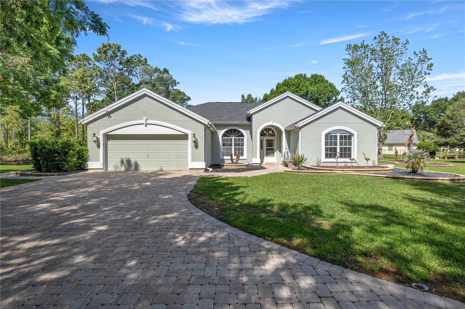 Beautifully updated pool home in a 55+ community located on a quiet cul-de-sac in Oak Run—offering a rare blend of privacy, space, and resort-style amenities.Situated on a spacious half-acre private lot that sits along the Ross Prairie State Forest with access to the paved bike path.—perfect for those seeking quiet, low-traffic living without sacrificing convenience. Just minutes from Oak Run’s clubhouses, pools, fitness center, golf course, and social activities, this location delivers the best of active living.This move-in ready 3-bedroom, 2.5-bath home has been beautifully maintained and updated with a brick paver driveway and walkway, new landscaping, freshly painted interior, and a garage with epoxy flooring. Inside, you’ll find a remodeled primary bath, updated flooring in the primary suite, a convenient half bath, and an interior laundry room.The kitchen and living areas feature newer appliances, washer and dryer, updated sink and faucet, stylish backsplash, and modern hardware throughout. Additional home upgrades include new water softener, new light fixtures, updated door hardware, new front screen door, upgraded mailbox with lighting, cleaned ductwork, and updated sprinkler system.Step outside to your private fenced backyard for your fur baby. Take a dip in the heated pool with all new pool cage screens, plus a new pool pump and heater—ideal for year-round Florida living and entertaining.Major updates include a new roof (2021) and HVAC (2018) for added peace of mind.Enjoy golf community living with resort-style amenities. This is a rare opportunity to own a private cul-de-sac pool home with this level of updates and lot size—features not commonly found together in this price range within Oak Run.