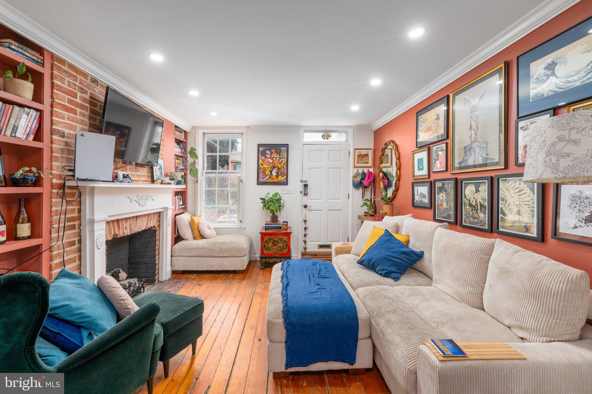 Discover the perfect blend of historic charm and modern updates in this 3-bedroom, 2-bath home in the heart of Federal Hill! Featuring beautifully refinished original hardwood floors, exposed brick accent walls, 1800s fireplace mantels, built-ins, a formal dining room, and a spacious eat-in kitchen with a built-in desk area. The kitchen also boasts a Samsung 27 cu. ft. Bespoke French Door refrigerator (2024). Upstairs, the second level offers two generous bedrooms flanking a fully renovated center hall bath and access to a delightful private deck. The entire third level serves as a private owner’s suite with a large bedroom, office/reading nook, updated bath, and abundant closet space. Additional highlights include a finished basement with in-unit laundry, a private rear PARKING SPACE, and major system upgrades: new HVACs and furnace installed in 2024. All this just steps from local restaurants, shops, and nightlife, plus Federal Hill Park and the Inner Harbor. An easy commute to the University of Maryland, Johns Hopkins, the Baltimore Business District, and commuter routes I-95, I-295, and I-83.