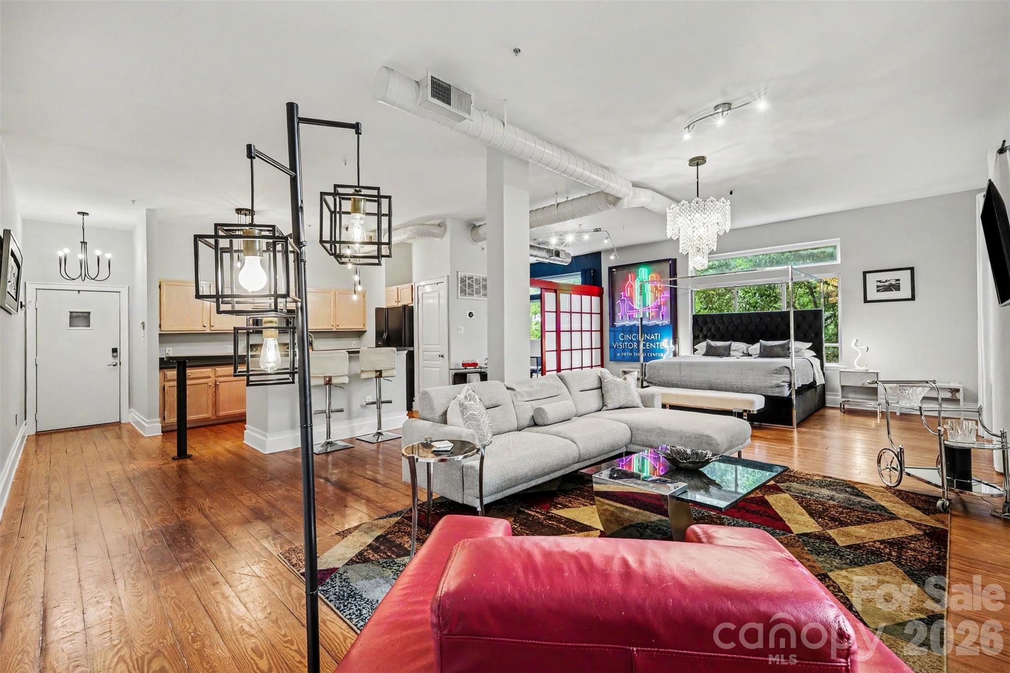 TURNKEY FURNISHED corner unit in sought-after Elizabeth Lofts in the heart of Charlotte’s vibrant Elizabeth neighborhood! Ideal for owner-occupants, second-home buyers, or investors, this move-in ready condo offers SHORT-TERM RENTAL potential with rentals permitted at a minimum of seven days. Flooded with natural light, this stylish urban retreat features soaring 10-foot ceilings, oversized windows, exposed ductwork, wide plank hardwood floors, and an open-concept layout perfect for entertaining, working from home, or everyday living. Loft-style bedroom includes built-in storage/workspace plus oversized walk-in closet with custom shelving. Renovated bathroom with custom tile shower and updated finishes. Secure building with elevator, gated covered parking, assigned owner space, visitor parking, and landscaped courtyard with grill and gathering area. WALKABLE to Elizabeth’s hottest restaurants, coffee shops, boutiques, hospitals, and greenway access, with Uptown and Plaza Midwood just minutes away. Rare fully furnished opportunity in one of Charlotte’s most desirable urban communities!