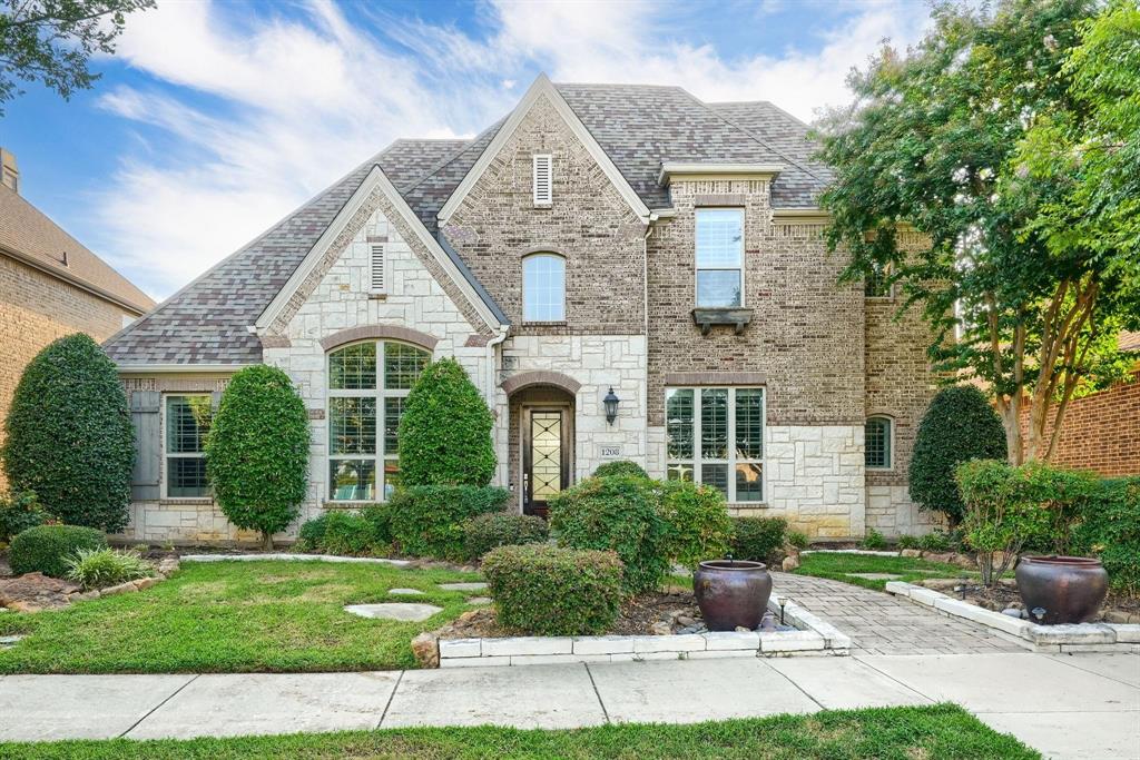 Welcome to this stunning former Highland model home, perfectly located in the prestigious Castle Hills community of Lewisville! This beautifully designed 5-bedroom, 4.5-bath residence offers over 4,183 square feet of luxury living, with high-end upgrades, smart functionality, and timeless style throughout. 
Features & Upgrades You'll Love:
* Solar power system – enjoy energy efficiency and lower utility bills
* Whole-home water softener and tankless water heater
* Included appliances – refrigerator and elegant extended dining table
* Designer touches – plantation shutters, custom drapes, and wood flooring
* Chef’s kitchen – gas cooktop, large island, built-in cabinets, designer backsplash, walk-in pantry.
* Spacious family room with vaulted ceilings, exposed decorative beams, and a cozy fireplace
* 3-car tandem garage with epoxy floors and an extended office,flex space.
* Luxurious primary suite with bay windows, dual vanities, walk-in shower, and oversized walk-in closet
Upstairs Entertainment & Living Space:
* Three bedrooms upstairs—ideal for family or guests
* Jack and Jill bathroom between two bedrooms for added convenience
* Expansive game room featuring a built-in wet bar—perfect for entertaining
* Dedicated media room equipped with built-in surround sound speakers.
* Built-in computer desk – great for homework or home office needs
Additional Highlights:
* Private study with custom built-in bookcases
* Large laundry room with sink and extra storage
* Rear-facing driveway and covered patio ideal for outdoor gatherings
Castle Hills Lifestyle & Amenities:
* Newly renovated park directly across the street
* Access to resort-style pools, tennis courts, lakes, playgrounds, and jogging trails
* Zoned to top-rated Lewisville ISD
* Close to major highways, dining, shopping, and entertainment
*Photos feature virtual-staged furniture and may not reflect current furnishings.