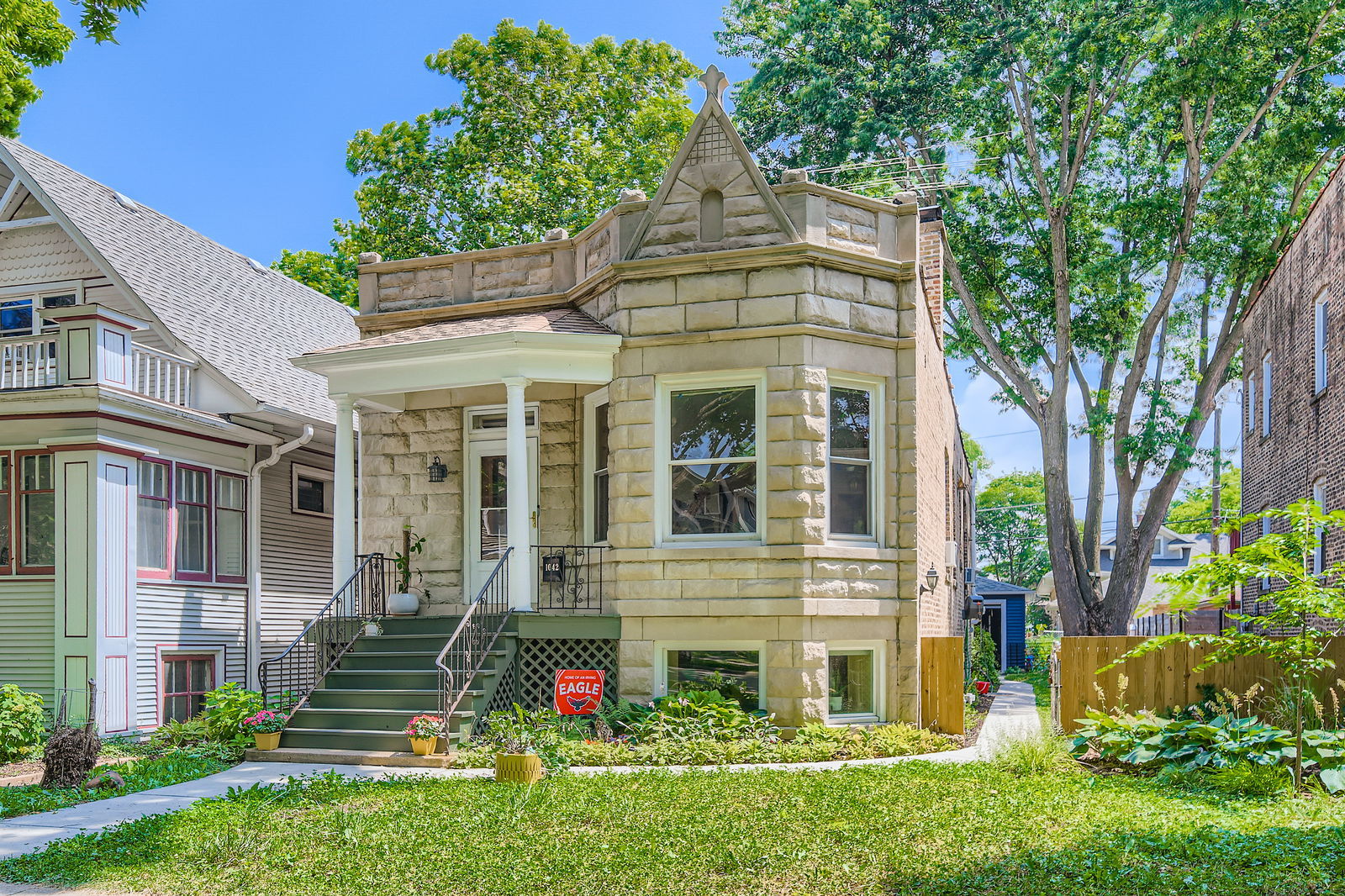 Tucked away on a peaceful cul-de-sac just half a block from Rehm Park, this classic greystone blends vintage charm with everyday comfort. The main level offers a smart and functional layout featuring three bedrooms, a full bathroom, spacious living and dining areas, and a kitchen with a generous walk-in pantry. The finished basement expands your options with a flexible in-law setup that includes a second full bath and kitchenette-ideal for guests, extended family, or a home office.    Timeless details like original hardwood floors, handcrafted wood trim, and a built-in hutch in the dining room add warmth and character throughout. Step outside to enjoy the private patio-great for summer barbecues-and a large side yard ready for your garden dreams or recreation space.    Located just a 5-minute stroll to the Blue Line, this well-maintained home offers flexibility, space, and an unbeatable location at an excellent value.