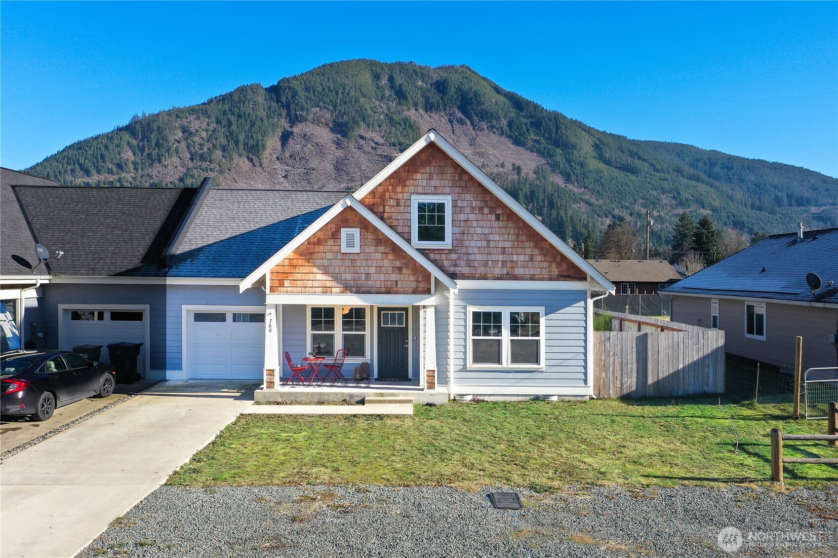 Nearly New quality construction. Solid 1486 Sq Ft 3-bedroom, 2 bath home w/cement fiber siding. 30-year architectural comp roof. Primary Suite on MAIN level w/ceramic tile floors. Covered patio & alley access. Forced-air heat pump for AC & heat. Tankless water heater. Kitchen features quartz countertops, SS kitchen appliances and free-standing gas range. All Solid-core interior doors. Gas fireplace in living room. Garage wired for electric car charging system. Skylight w/remote. Views of Whitehorse Mountain. Walk to town. Mountains in your backyard, close to many outdoor adventures!