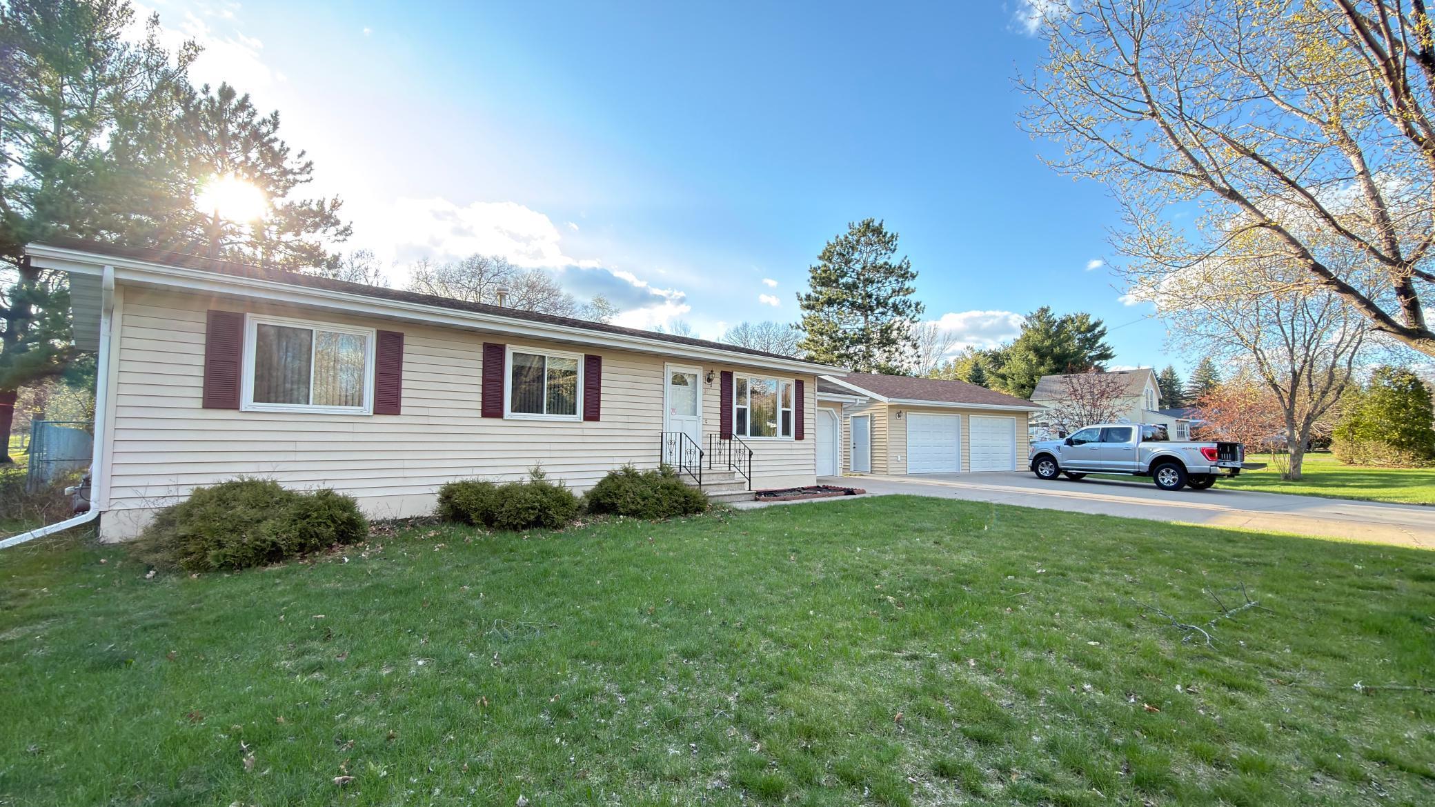 This charming 3 bed, 2 bath property offers a comfortable and practical layout, with all three bedrooms located on the main level making it ideal for easy, everyday living. The lower level features a spacious family room, second bathroom, laundry area, and the potential to add a 4th bedroom with the addition of an egress window giving you the opportunity to build equity over time. Sitting on a large, fully fenced half-acre lot, there’s plenty of space for pets, outdoor entertaining, or simply enjoying your own backyard. The attached 1-stall garage, detached 2-stall garage, and generous concrete driveway provide ample parking and storage. Located near Pine Grove Park, you’ll enjoy easy access to outdoor recreation while still being close to everyday conveniences. This property is a great place to start your homeownership journey with room to grow!