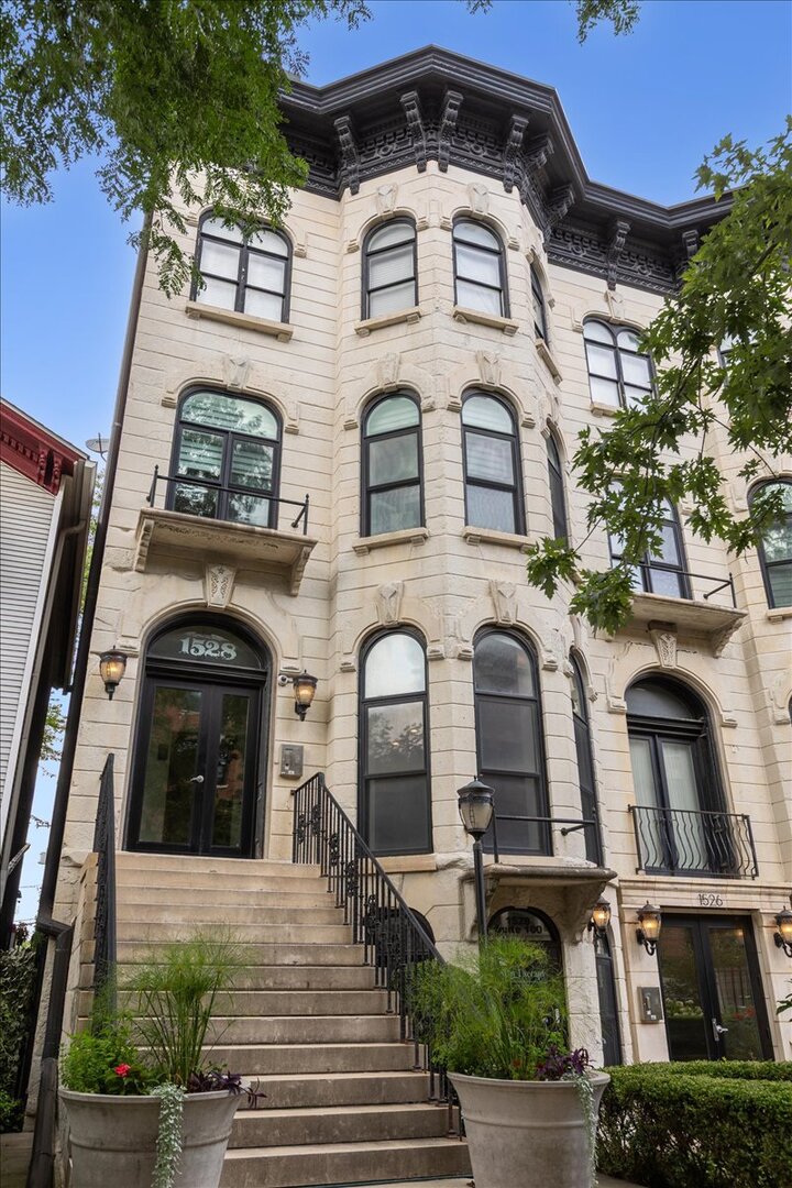 Light-filled 3 bedroom, 2.1 bath home in a prime West Loop location. An open living/dining room showcases a marble-detailed fireplace, crown molding, and bay windows that invite all-day natural light. The kitchen features stainless steel appliances, 42" cabinetry, quartz counters, and an island with breakfast bar seating. Spacious primary suite with dual vanity, deep jetted soaking tub, and separate shower with body sprays. A custom built-in bookcase in the second bedroom creates an ideal study and adds smart storage. Brazilian cherry hardwood floors run through the living spaces, and closets are professionally organized. In-unit laundry (stackable W/D). Attached garage parking INCLUDED. Enjoy a beautifully landscaped common courtyard perfect for entertaining. Unbeatable access to Downtown, expressways, Skinner Park, award-winning West Loop dining, boutiques, and public transit.