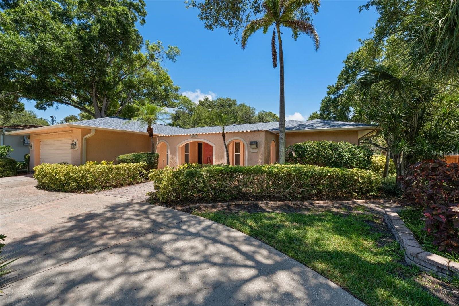 Under contract-accepting backup offers. Perfectly positioned along one of the fairways of the historic Dunedin Golf Club, this spacious 4-bedroom, 3-bath pool home offers an exceptional opportunity to enjoy one of Dunedin's most desirable golf course settings. Overlooking the beautifully restored Donald Ross-designed course, once home to the PGA of America, this home combines generous living spaces with an unbeatable location.Designed with a functional three-way split bedroom floor plan, the interior is filled with natural light and offers flexibility for families and guests alike. A charming courtyard entry welcomes you inside, where separate living and family rooms provide multiple gathering spaces. The chef's kitchen features a gas range, double ovens, abundant workspace, and a convenient pass-through window to the screened lanai, making entertaining effortless.The expansive screened pool area offers plenty of covered outdoor living space to relax, dine, and enjoy Florida living year-round. A large laundry room includes extensive built-in cabinetry and a dedicated office or hobby workspace. Major updates include a new roof installed in 2025.Beyond the home, you'll enjoy one of Dunedin's most active and walkable neighborhoods. Stroll to the Dunedin Community Center for its fitness center, gymnasium, group exercise classes, camps, and year-round community programming. Adjacent to the community center, the Dunedin Fine Art Center offers galleries, art classes, exhibit halls, a children's museum, café, gift shop, and hosts numerous festivals and cultural events throughout the year.Nearby you'll also find the Highlander Park Aquatic Complex and Splash Pad, Hammock Park, the Dunedin Nature Center, pickleball and tennis courts, and the renowned Pinellas Trail. A quick golf cart ride takes you to vibrant Downtown Dunedin, home to award-winning restaurants, breweries, boutiques, the marina, and countless community events and festivals. Best of all, you're less than 10 minutes from the pristine Gulf beaches of Honeymoon Island State Park and approximately 30 minutes from Tampa International Airport.This is a rare opportunity to enjoy golf course living while being surrounded by the very best of Dunedin's recreation, culture, and coastal lifestyle.