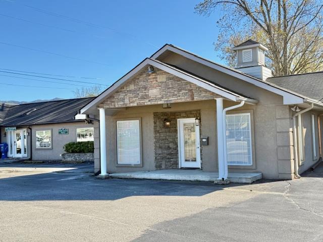 Endless Possibilities in the Heart of Andrews, NC! Located right on Main Street, this beautifully renovated and exceptionally well-maintained building offers incredible versatility and curb appeal. The spacious reception or living area features a stunning fireplace and abundant natural light from large windows. Inside, you'll find four private rooms, two full bathrooms, a kitchenette, laundry room, administrative area, and additional bonus spaces, perfect for a wide variety of uses. A separate one-bedroom, one-bath apartment with its own private entrance provides ideal living quarters or rental income potential. This property could easily function as a day spa, medical or professional office, retail store, or live/workspace. The choice is yours! Enjoy the convenience of being within walking distance to local shops and restaurants in charming downtown Andrews. Furniture may be included, making this an outstanding turnkey opportunity.