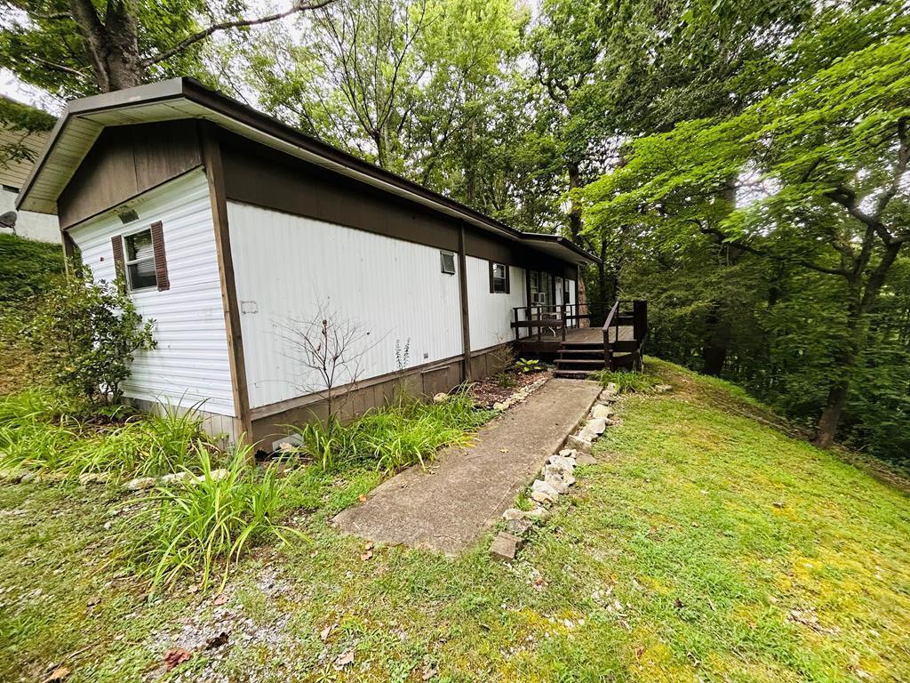 This unique property combines six contiguous parcels bordering Calhoun-Gwyn-Civitan Park, providing unparalleled access to its walking/running trails and the Holston River. One parcel includes a singlewide trailer, while another building boasts 220-volt electrical service, offering immediate potential for various uses. This expansive property presents an opportunity to create a private residence, rental property, develop multiple homesites, or establish a unique recreational retreat with direct access to nature and outdoor activities. Come see it today!