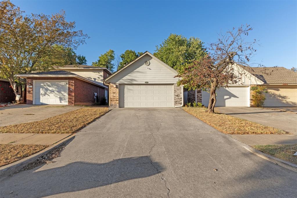 Such a BEAUTIFUL and absolutely perfect half-duplex in the Truman school district. This house offers a spacious layout, private fenced courtyard, and open concept kitchen. Tucked away in the back of a cul-de-sac, this house proves for quiet and safe living. The living room displays hardwood floors, and roaring fireplace and a darling wet bar area for cocktails or coffee bar area. The kitchen/dining room area has a sliding door that opens up to your covered courtyard and patio area with the cutest pink colored front door. Boasting 3 spacious bedrooms, large closets,  and 2 full baths this place is set up for family life or college roommates who need space and comfort.  This duplex has been renovated and beautifully done and cared for. Only a 12 minute drive to University of Oklahoma so this would be a perfect house for anyone with a student that lives off campus . Newer refrigerator and new washer and dryer stay with property. Ring camera stays with property as well as outdoor cameras