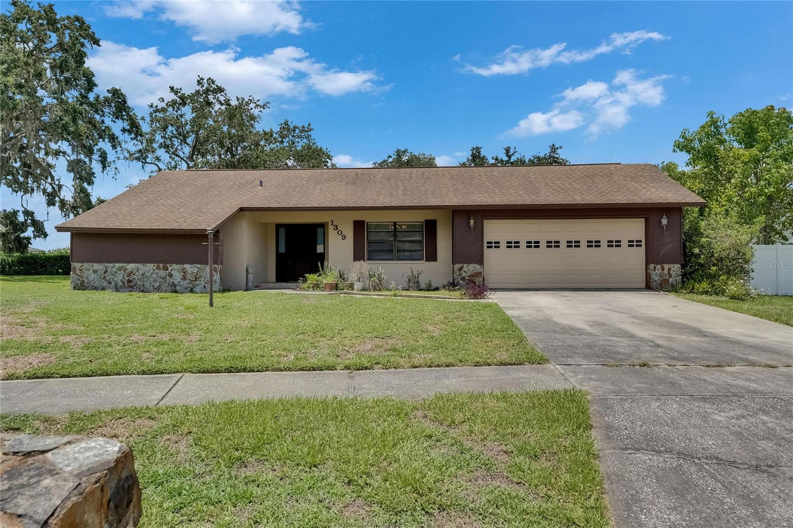 One or more photo(s) has been virtually staged. Welcome to this spacious 4-bedroom, 2-bath home in the desirable Walden Lake community, offering great potential and charm! This lovingly cared-for home features a 2019 roof and newer A/C, providing a solid foundation for your personal updates. The split floor plan includes a private primary suite, while three secondary bedrooms share a full bath. You'll find multiple living areas including a formal living and dining room, plus a large family room with a cozy fireplace. The kitchen boasts Corian countertops and a window overlooking the expansive backyard—perfect for future outdoor enjoyment. A large screened lanai adds to the living space, ideal for Florida evenings. Walden Lake offers wonderful amenities including a community pool and tennis courts, all for a low HOA fee of just $275 annually. Don’t miss the opportunity to make this gem your own!