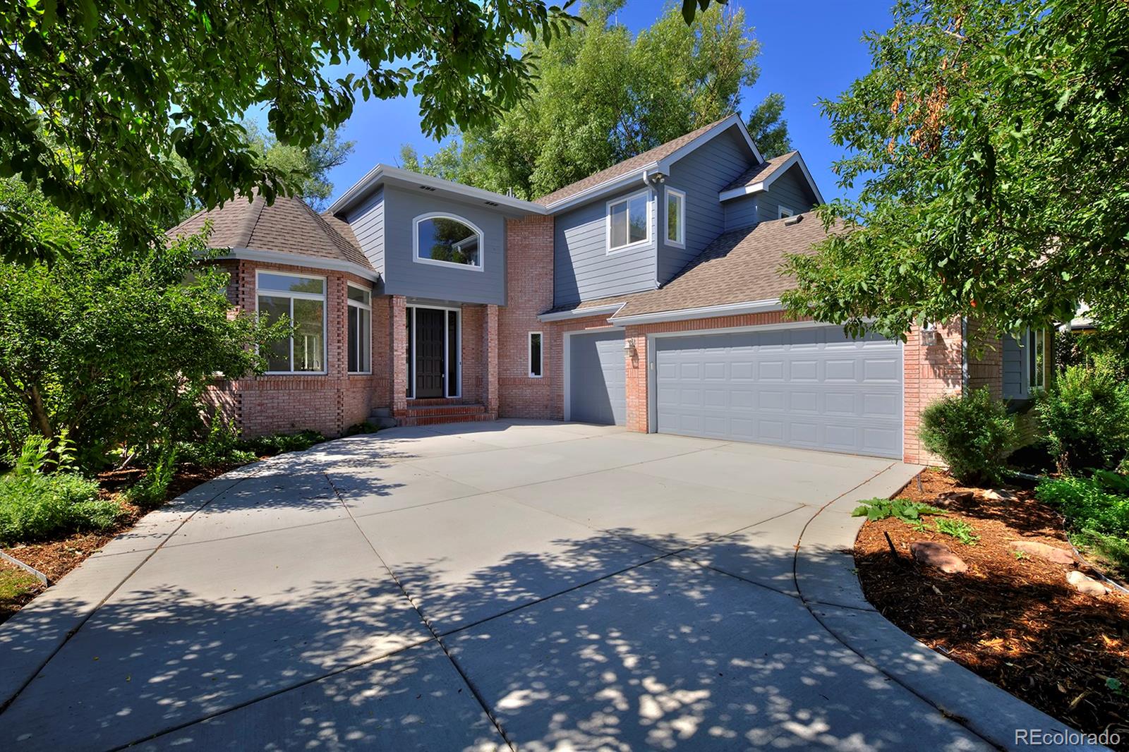 A true Boulder “unicorn” property, this luxury remodeled home backs to forested open space in an established, friendly neighborhood. Fresh, high-end finishes abound, and windows frame peaceful tree-filled views and fill the home with natural light from morning through evening. Your all-new kitchen is made for meaningful gatherings, with expansive quartz surfaces, an induction range, huge banks of custom Norwegian white oak cabinets, and peaceful views onto stands of swaying trees. Natural ash hardwood flooring, designer lighting and a neutral modern palette carry throughout the home. Entertain with ease in the open-concept living spaces or enjoy the expansive deck overlooking the fenced backyard and surrounding greenery—a dreamy setting for morning coffee or summer dinners. The primary suite was inspired by the owners’ favorite designer hotels—a place to unwind beside your private fireplace, soak in the sculptural freestanding tub or spa-style shower, and enjoy the oversized, walk-in, custom closet. The flexible floor plan offers exceptional versatility with a main-level office or guest bedroom and full bath, three bedrooms upstairs including a Jack-and-Jill bath, plus an enormous walk-out lower level with two additional bedrooms, a bathroom, separate entrance and abundant living space that's ideal for guests or for lock-off unit potential. Set in one of North Boulder's most beloved neighborhoods, you'll enjoy miles of nearby trails and paths, a close-knit community close to the best of Boulder, fragrant spring-blooming plum trees, a three-car garage and the rare combination of luxury living with nature right outside your back door.