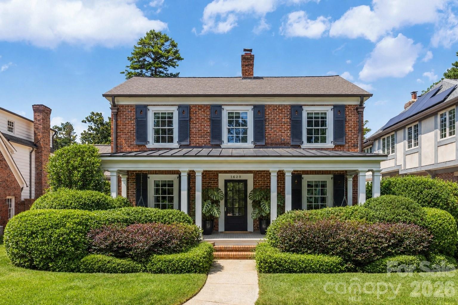 Positioned on a premier quarter-acre lot in historic Eastover, considered one of Charlotte’s most sought-after enclaves, 1620 Biltmore Drive presents nearly 4500 square feet of refined architecture and exceptional craftsmanship. This 5-bedroom, 3.5-bath residence strikes a perfect balance between stately traditional design and an effortless, flowing floor plan tailored for todays luxury living.The main level is defined by high-end custom millwork, exquisite hardwood flooring and generous rooms filled with natural light. Everyday living centers around a sun-drenched family room, generously proportioned to accommodate substantial furnishings and a grand piano. Designed for seamless entertaining, the formal dining room transitions effortlessly from the kitchen through a custom butler’s pantry, featuring double doors that open outward for fresh-air gatherings. The light-filled chef’s kitchen serves as a true culinary center, anchored by a rich mahogany wood block island and outfitted with high-end appliances: a Sub-Zero dual refrigerator-freezer, a Viking Professional electric double oven, a Viking Professional 6-burner gas range with a gas-fired griddle and dual Bosch dishwashers. Off the kitchen, step directly out to a side stone patio which serves as a secluded, brick-walled nook ideal for morning coffee. Main-floor versatility is further enhanced by a dedicated sitting room or library, while sliding door partitions offer the flexibility to enjoy an open-concept feel or close off spaces for added intimacy.Upstairs, five generous bedrooms offer exceptional versatility, including one room with custom built-in cabinetry that could effortlessly function as an executive home office. The crown jewel of the upper level is the secluded primary wing, completely closed off by sliding doors to create an ultra-private sanctuary. This expansive suite encompasses its own private hallway, an oversized bedroom, a dedicated sitting and reading lounge, dual walk-in closets, and a spa-inspired bath complete with vaulted ceilings, a jet tub and a massive double shower.Outdoor living is equally refined, featuring a covered rear porch that overlooks a manageable, tree-lined yard enclosed by a timeless decorative brick wall for maximum privacy and security. Modern updates offer true peace of mind, including a recently replaced HVAC system.  A tandem two-car garage equipped with ample loft space provides extra storage.Located within minutes of Charlotte’s premier hospital campuses, the original Mint Museum, Little Sugar Creek Greenway, Eastover Park and Uptown Charlotte, this property proves that timeless luxury and location go hand-in-hand.