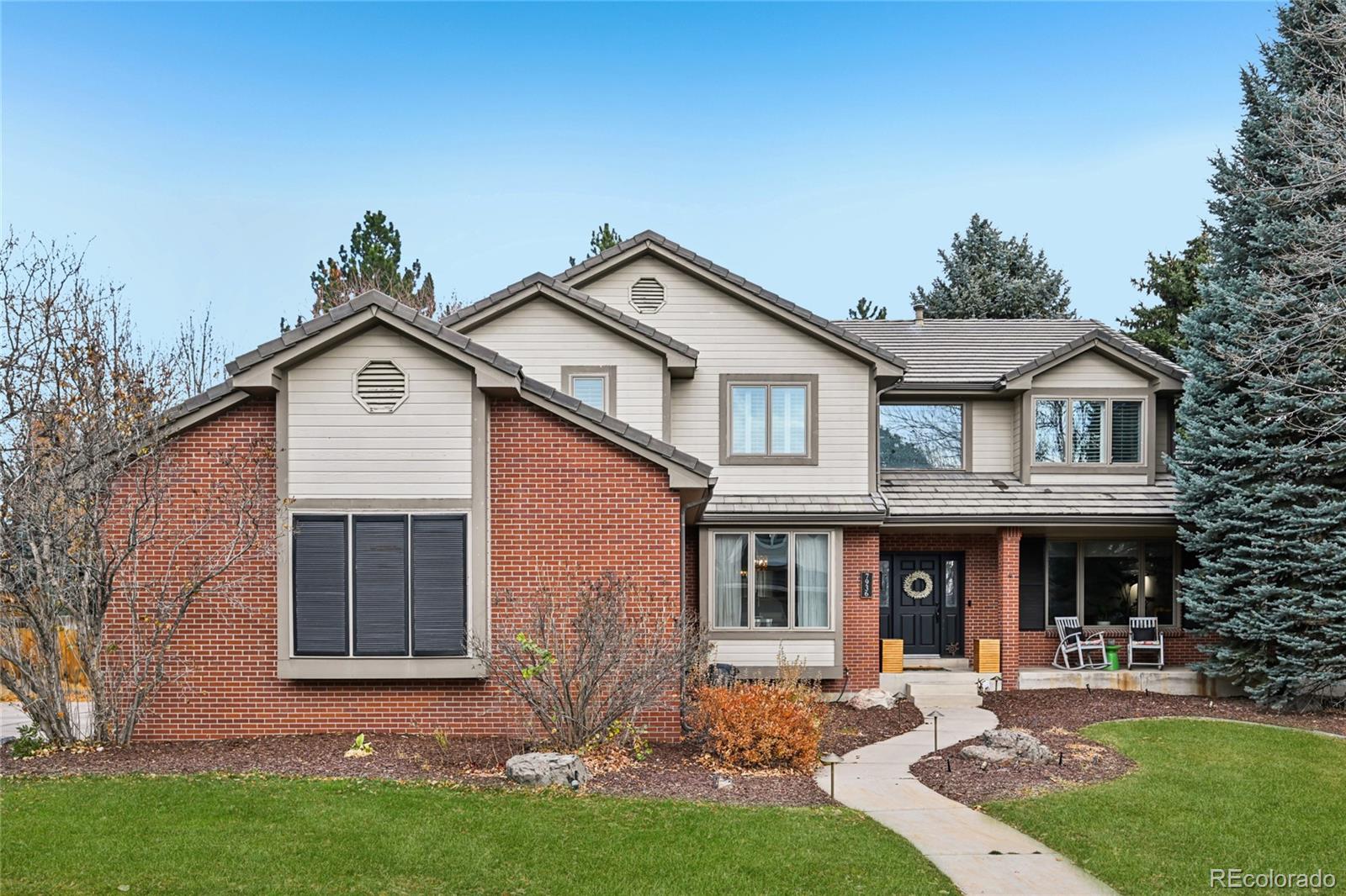 Nestled on the best street in the the highly sought-after Heritage Greens community, 7936 S Eudora Circle is a thoughtfully updated and just minutes from top-rated schools, shopping, and dining.  All-new interior paint, beautiful hardwood floors, upgraded light fixtures, and curated finishes greet you upon entry and unfold into a spacious layout ideal for everyday living and entertaining. This unique and open floorplan seemlessly connects the living and dining spaces  to the well-appointed gourmet kitchen. Enjoy preparing meals with two-toned soft-close cabinetry, granite countertops, a stainless steel appliance package, a center island, and an inviting breakfast nook. The coffered ceilings and gas fireplace with custom tile surround are flanked by built-ins and serve as the focal point of the airy great room. Step out the new patio door to a large composite deck, ready for summer BBQs and cozying up by the fire while overlooking mature and professional landscaping with lighting package. Upstairs, the private living quarters include three generously sized secondary bedrooms (all with ensuite bathrooms and plantation shutters) and the primary suite. This sanctuary features vaulted ceilings, a gas fireplace, two huge walk-in closets with a custom closet system, and an ensuite 5-piece bath. Descend to the lower level entertainer’s basement. The wet bar includes granite counters, barstool seating, a pool table, and a theatre room with built-in speakers. A private 5th bedroom, bath and a home gym round out the lower level. Newer HVAC, a home office, ample storage, and an attached 3-car side load garage with the best driveway in the neighborhood.  Heritage Greens is a premier family-friendly neighborhood with multiple community events throughout the year, an outdoor pool, park, tennis courts, and a golf course, all just steps from your front door. 7936 S Eudora Circle offers the perfect balance of  style, and convenience in the heart of Centennial.