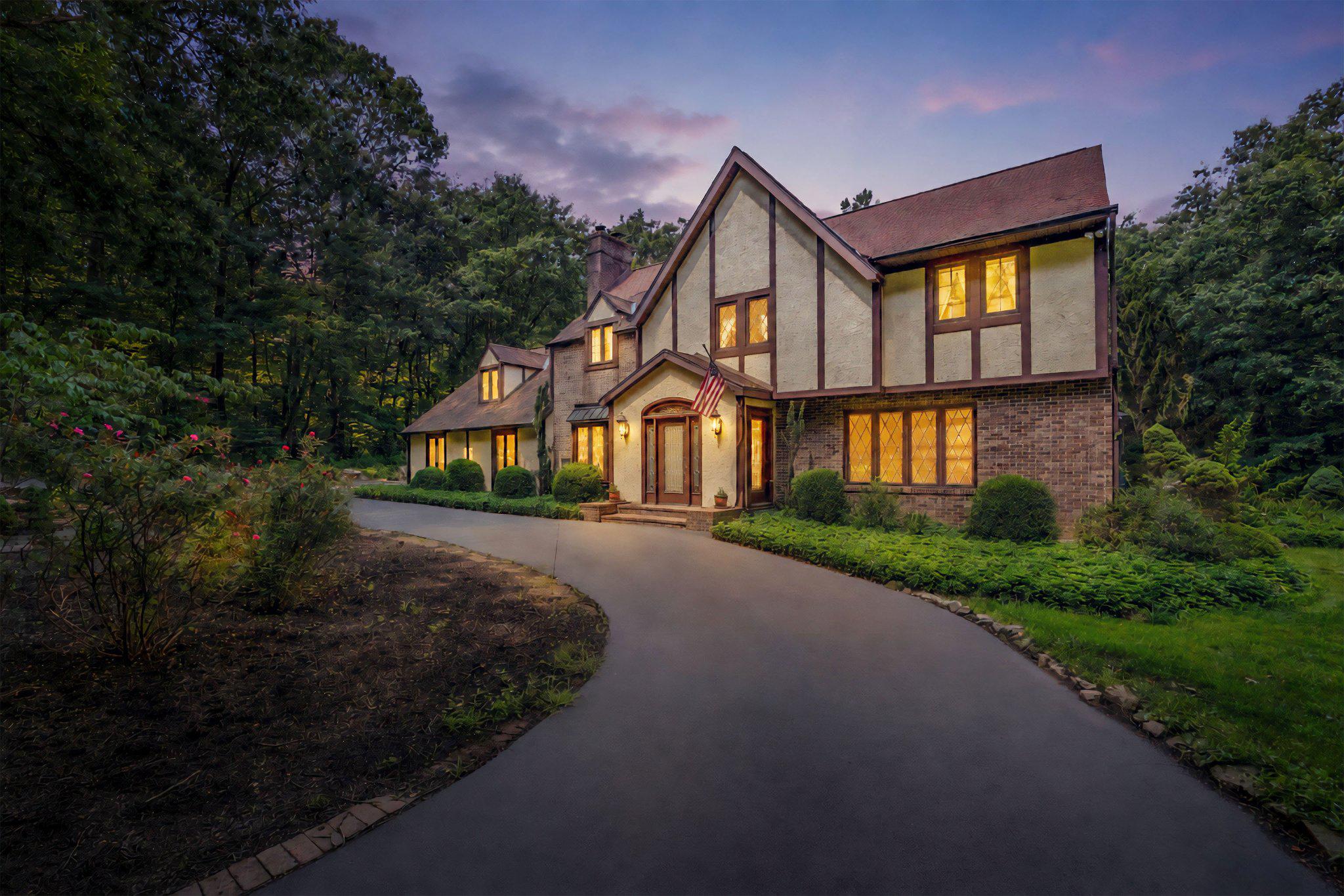 in the Fox Run neighborhood of Pottstown, set on 6 private acres backing up to French Creek State Park and near St. Peters Village. Offering 3,832 square feet of living space, a large circular driveway with parking for approximately 10 cars, an oversized 2-car garage, multiple fireplaces, generous room sizes, and exceptional privacy. This home is a rare opportunity for buyers looking for space, character, and a peaceful setting while still conveniently located near services. As you approach, mature trees, landscaping, and a quiet private setting create a welcoming first impression. Step inside through the brick vestibule and into the foyer with tile flooring and a ceiling light. To the right of the foyer, the living room offers hardwood floors, crown molding, recessed lighting, a fireplace, and a large front window that brings in natural light. Just beyond, the dining room features hardwood flooring, crown molding, a chandelier, and a charming side bay window. French doors lead from the dining room into the spacious all season sunroom, while a separate doorway provides access to the kitchen. The sunroom is one of the standout spaces of the home, featuring hardwood floors, vaulted ceilings with beams, skylights, a stone-surround fireplace, custom built-in cabinets and shelving, walls of windows, multiple chandeliers, and two sliding glass doors leading outside. With views toward the pool area and backyard, this room is ideal for relaxing, entertaining, or enjoying the secluded surroundings. The kitchen features hardwood flooring, quartzite countertops, solid wood custom cabinetry, stainless steel appliances, room for a breakfast table, and access to a butler’s pantry and a walnut slab full size wet bar with pendant lighting. The nearby family room adds another inviting gathering space with hardwood floors, a brick fireplace, ceiling beams, crown molding, wainscoting, and a triple front bay window with built-in bench seating. A convenient central powder room completes the main level. Upstairs, the spacious primary bedroom features wall-to-wall carpeting, a vaulted ceiling, dormer windows, ceiling fan, and access to a large walk-in closet area. The primary suite also includes a private sitting room with hardwood flooring, custom built-in cabinetry, and shelving, creating an ideal space for a reading room, office, dressing area, or quiet retreat. The en-suite bathroom features marble tile flooring, double sink vanities, and a step-in shower with views of the back yard. Three additional bedrooms provide comfortable accommodations for family, guests, or work-from-home needs, including one with built-ins and another with a built-in desk and shelving. A full hall bathroom with marble tile flooring, double sink vanity, skylight, and a clawfoot tub and separate shower completes the upper level. The lower level expands the living space with a large recreation room featuring vinyl plank flooring, computer desk, windows, and a ceiling fan with light. A dedicated laundry room includes built-in custom cabinetry, counter space, and front-load washer and dryer included with the home, while additional basement space provides room for storage, hobbies, utilities, or future possibilities. Outside, the property truly shines with 6 acres, mature trees, a large circular driveway, a brick patio off the sunroom, an in-ground pool, firepit, and a walking path leading to a shaded alpine pavilion with vaulted ceiling detail, beams, and a chandelier. With room to spread out and enjoy the outdoors, this property is ideal for entertaining, relaxing, hiking and gardening, or simply appreciating the tranquil privacy. Located in a quiet area bordering French Creek State Park and near charming St. Peters Village, this home offers the rare combination of acreage, privacy, character, and convenience. Don’t miss the opportunity to make 2323 Saint Peters Road your next home.