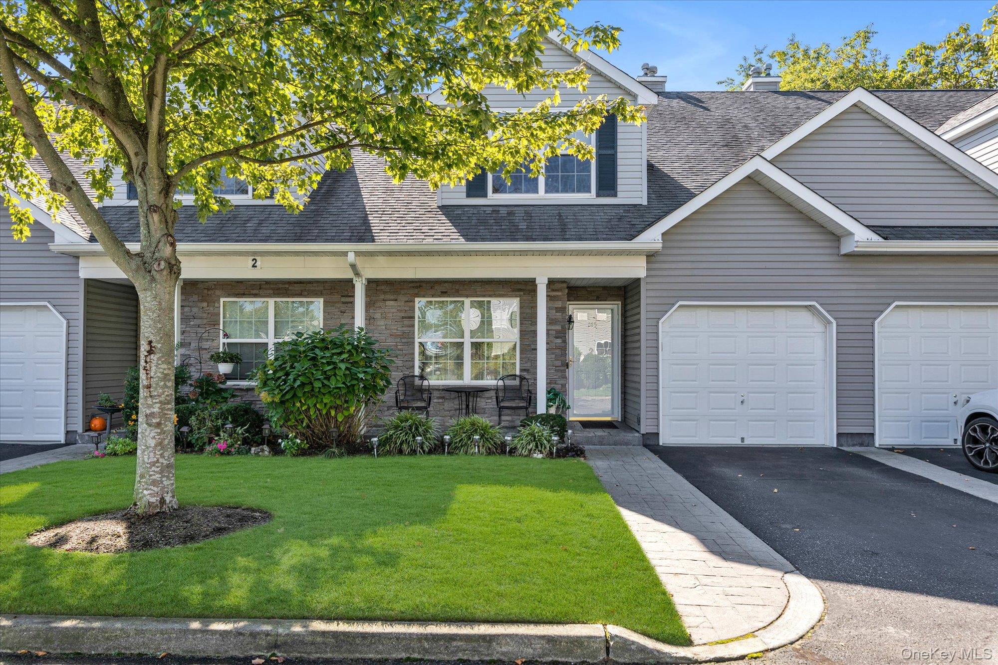 Discover comfort, convenience, and elegance in this beautifully appointed Sierra model townhouse nestled within the sought-after Islip Landing 55+ community. This exceptional home offers an ideal blend of modern design, thoughtful layout, and resort-style amenities—all just minutes from shops, dining, the train, and Fairfield Baseball Park.

Step inside to find a bright and spacious open-concept layout featuring two generously sized primary bedroom suites, each with its own private ensuite bathroom and walk-in closets—including one conveniently located on the first floor for single-level living flexibility.

The heart of the home is the stunning center island eat-in kitchen, perfect for both casual meals and entertaining. Outfitted with granite countertops, stainless steel appliances, and an abundance of cabinetry, it flows effortlessly into the cathedral-ceiling living room/formal dining room adorned with skylights and sliding glass doors that open to your private patio and backyard oasis.

Enjoy outdoor living in comfort under the motorized roll-up awning, ideal for relaxing with a book or hosting guests with views of the lush golf course landscape just beyond your yard.

Upstairs, a versatile loft space awaits—perfect as a home office, den, creative studio, or cozy reading nook. Elegant crown moldings throughout add a touch of timeless sophistication.

Additional features include:

Attached one-car garage for secure parking and storage

Clubhouse, pool, and fitness center exclusive to residents

Low-maintenance lifestyle in a vibrant, active adult community

This home is not just a residence—it’s a lifestyle. Whether you're downsizing or seeking a serene yet connected place to call home, this is a rare opportunity to enjoy resort-style living with a golf course view in one of Long Island’s most desirable 55+ communities.

Don’t miss your chance to make this exceptional property your new home.