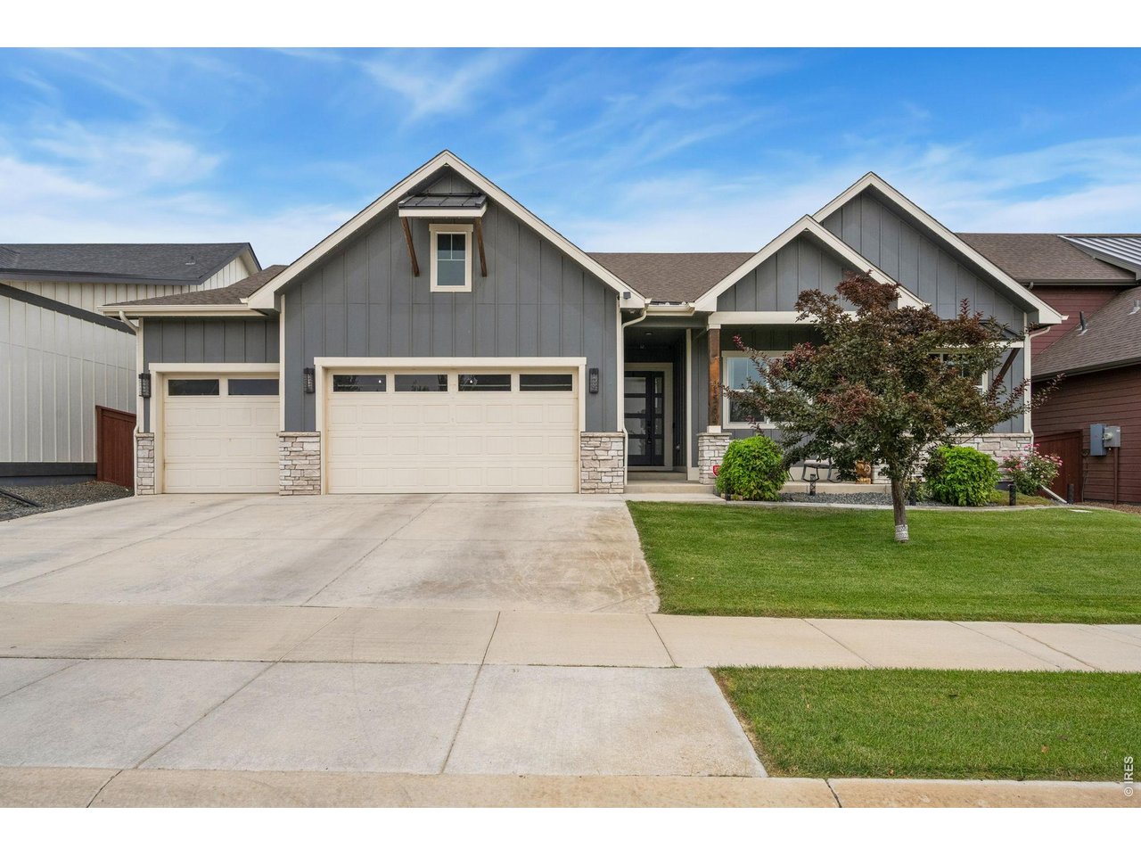 A rare 5-car garage takes center stage in this exceptional 4-bedroom, 3-bath ranch home, offering incredible space for vehicles, toys, hobbies, storage, or all of your Colorado gear. Inside, warm and inviting modern finishes create a stylish yet comfortable atmosphere with an open, functional layout designed for everyday living. The main floor showcases an open kitchen/dining/living layout, a spacious primary suite featuring a luxurious 5-piece bath and walk-in closet, a 2nd bedroom plus full bath, and a dedicated study, while the finished basement provides 2 additional bedrooms, a full bath, and a large entertaining space. Step outside to your own private retreat, where a large back patio offers a built-in outdoor kitchen space, an oversized spa that is included, and even a rock climbing wall for added fun. Just beyond your doorstep, enjoy the incredible amenities of RainDance, including the new school just steps away, multiple playgrounds, orchards, community gardens, miles of trails, and golf cart-friendly streets for easy access to RainDance River Resort, restaurants or the golf course. Conveniently located with quick access to I-25, this home delivers an exceptional blend of space, lifestyle, and location in one of Northern Colorado's most desirable communities.
