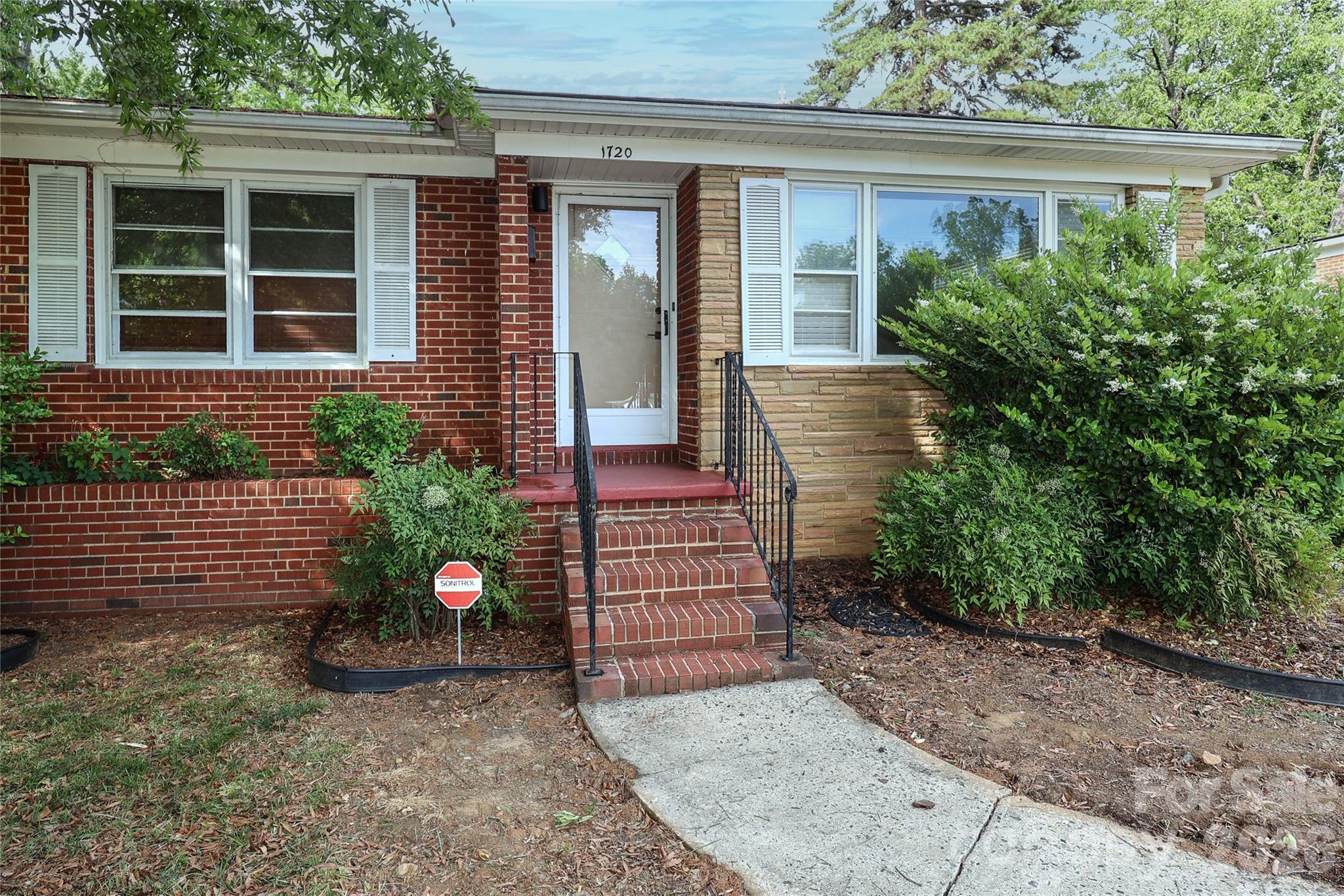 DESIRABLE NORTHEND HISTORIC DISTRICT! Fully remodeled, all brick transitional ranch home in the popular historic NorthEnd Oaklawn Park community. New features inside include complete kitchen remodel with light cabinets, stainless appliances, new quartz countertops, and tile backsplash. Spacious primary bedroom. Fully updated bathrooms, including ensuite primary bath. Gorgeous original hardwood floors thruout most of the main level. New 30-year architectural shingle roof and gutters. Nice size screened in porch. Fenced back yard. Two-car carport with storage. Short walk to the Irwin Creek greenway. Walking distance to the CityLYNX Gold Line which runs thru Biddleville, Wesley Heights, Uptown, and Elizabeth. $500,000+ new construction and remodeled homes all around. Three quarters of a mile to Uptown Charlotte!!