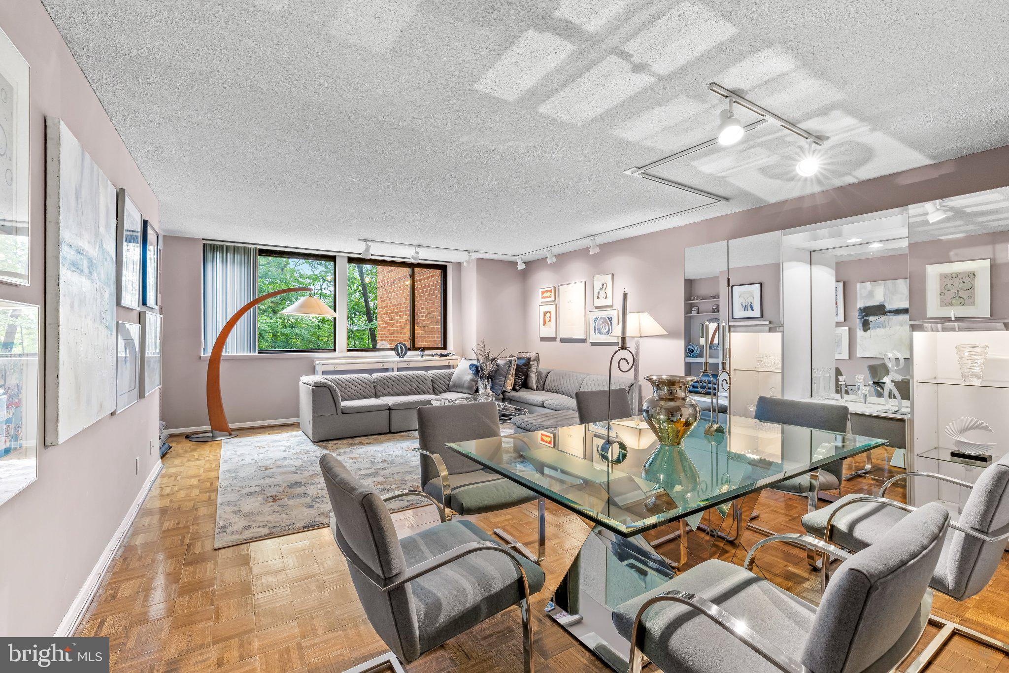 Long-term owner has continuously updated and meticulously maintained this stylish two bedroom unit – Efficient, glamorous with a sparkle of art deco, this fourth floor condo is beautifully curated and ready for a new owner. Parquet Floors, updated kitchen and baths, office built-ins, washer and dryer in unit, additional storage, two covered parking spaces. Full service well run building with helpful staff. The Village of Cross Keys has truly had a renaissance. Wonderful restaurants, a bakery, ice cream shop, summer produce market, three swimming pools, tennis courts, walking trails – all at your fingertips. Easy to enjoy and easy to thrive!