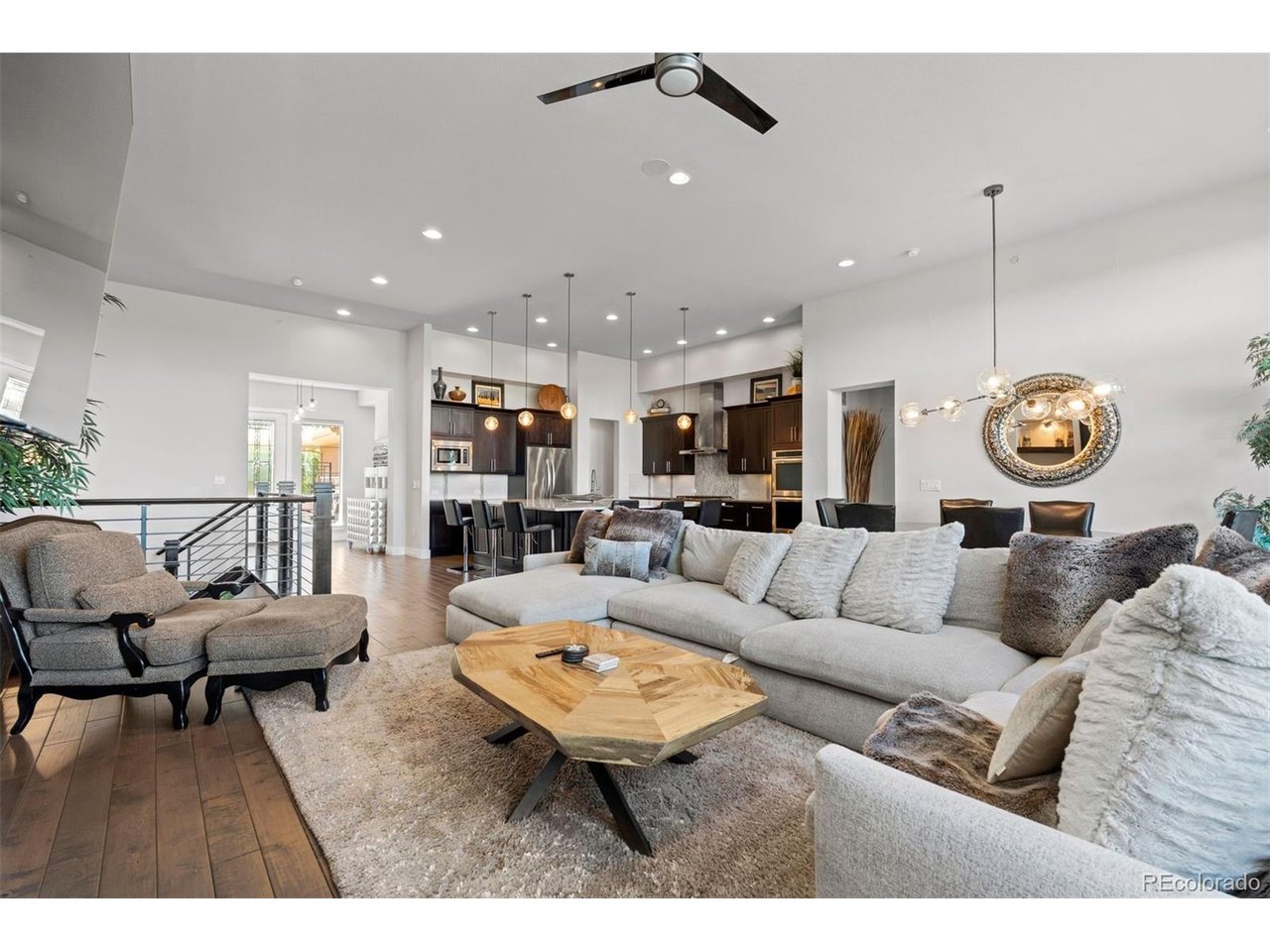 ** PRICING UNFURNISHED $1,595,000** Welcome to this incredible 3-bed, 4-bath, 3-car garage villa situated in the sought-after gated community of Villas At Vallagio III in Inverness. Ideal as a primary residence or a lock and leave retreat, this home greets you with an oversized gated courtyard before opening into a bright, open floor plan. Main-level features include soaring 12-foot ceilings, gleaming wood floors, and floor-to-ceiling windows overlooking the first green and second tee box of the semi-private Inverness Golf Course. The chef's kitchen boasts upgraded stainless steel KitchenAid appliances, granite countertops, a large walk-in pantry, and an island with seating for six. The main-floor primary suite offers golf course views, direct deck access, a spa-like bath, an oversized walk-in closet with custom built-ins, and main-floor laundry connection, alongside a flexible second main-level bedroom or office with an en-suite bath. The finished walkout basement expands your space with an oversized family room, a third bedroom, a full bath, and a four-season patio for year-round outdoor living. Enjoy total maintenance-free living with HOA coverage for front and rear landscaping, snow removal on the driveway to the front door, interior and exterior water and exterior maintenance including roof and insurance. In addition to the semi private, 18 hole golf course a membership at the Hilton at Inverness provides amenities like indoor and outdoor pools, tennis, pickleball courts, and a gym that are only a short walk away. With effortless commuting access via C-470, E-470, I-25, and light rail a Broncos, Nuggets, Rockies game or a night out in downtown is an easy commute. If going downtown isn't in your future many restaurants are within easy walking distance including Fleming's, Eddie Merlot's, and Breckenridge Brewery as well as others. This home is being offered with the option of being fully furnished or individual furniture being sold.