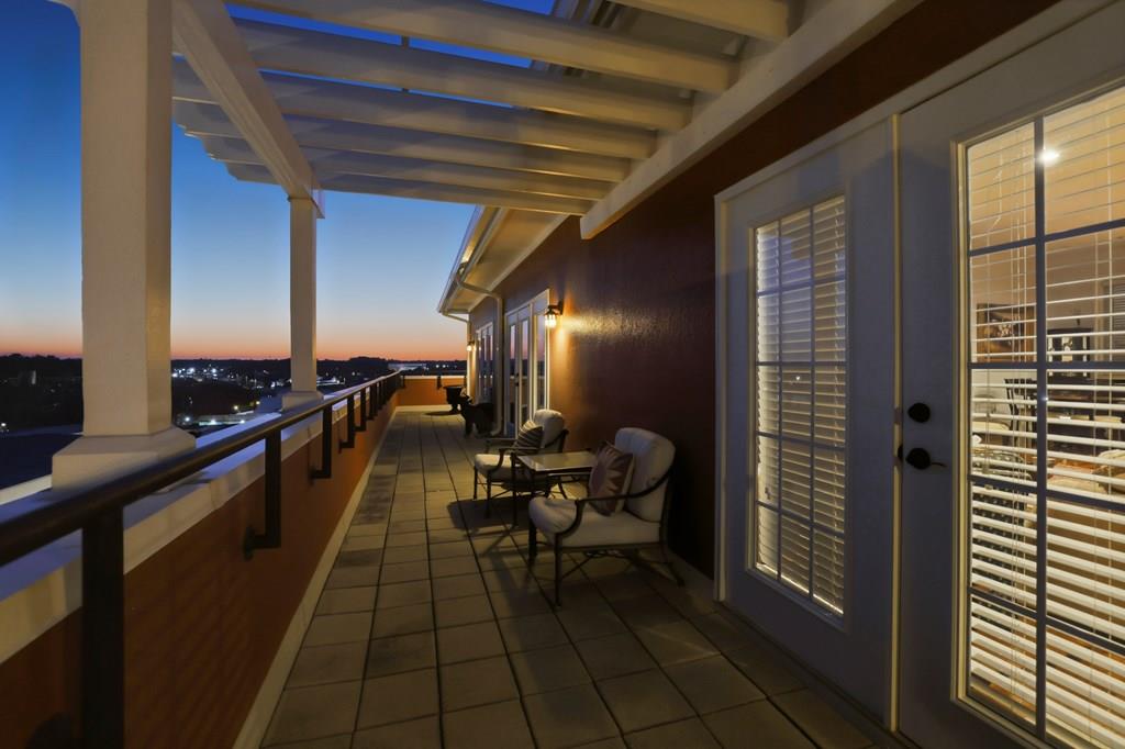 Exquisite penthouse-level 2 bedroom, 2 bath residence at the iconic Mitchell House overlooking the corner of Jackson and Broad Streets in the heart of historic downtown Thomasville, Georgia. Beautifully updated, this exceptional condo features spacious living areas, two generously sized bedrooms, and remarkable outdoor living space — offering the largest balcony of any residence in downtown Thomasville and providing the perfect setting to enjoy the charm and energy of the city below. Originally constructed in 1875, The Mitchell House was one of Thomasville's first grand luxury hotels and served as a celebrated winter retreat for prominent northern families including the Goodrich and Vanderbilt families. Known for its lavish parties and elegant gatherings, the hotel became a centerpiece of Thomasville's famed winter resort era. Today, the building stands as one of downtown's most distinguished addresses, thoughtfully preserved as upscale condominiums while retaining many of its original architectural elements including exposed brick walls, historic staircases, and rich hardwood floors. In the early 1900s, the property was also home to Neel's Department Store and hosted Thomasville's very first Rose Show in 1922. This rare penthouse opportunity offers the perfect blend of historic character, modern comfort, and an unparalleled downtown location — a chance to own a truly special piece of Thomasville history.