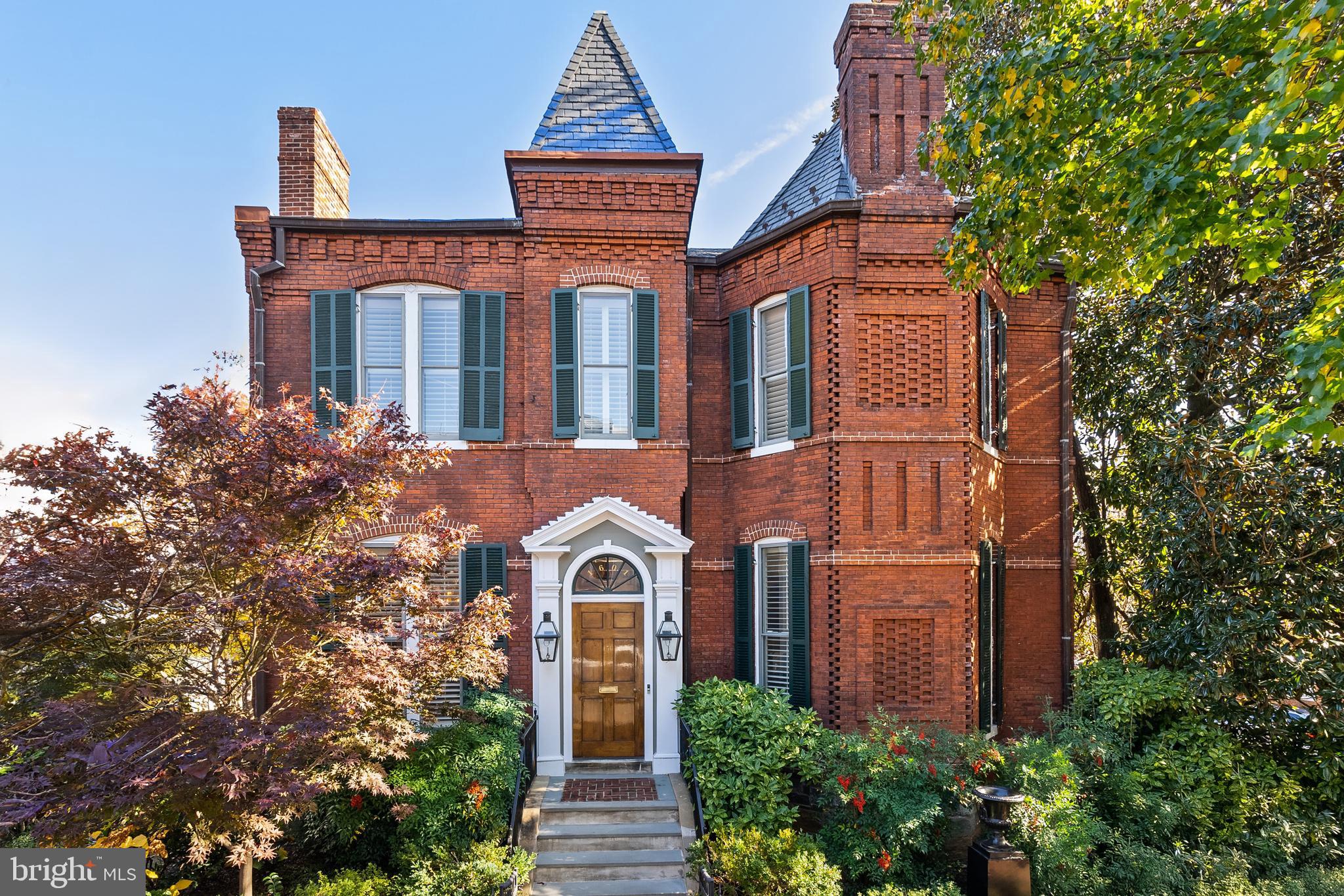 Sited on a charming and large 0.14-acre corner lot in Georgetown, 1601 28th St NW presents a masterfully crafted, stately Victorian, offering a seamless blend of comfort and ageless sophistication. Originally built circa 1880 along with two other homes within the historic Evermay Estate, the residence boasts 5 Bedrooms, 5 Full Bathrooms, and 1 Half Bathroom across 4 Levels and approximately 6,100 total square feet. The Main Level impresses with soaring 10'9” ceilings and features an inviting Foyer leading to spacious formal Living and Dining Rooms, ideal for entertaining. The Gourmet Kitchen features a Butler’s Pantry, Breakfast Area, and seamlessly flows into a connecting Family Room, with easy access to the rear Deck and flat rear garden, perfect for indoor/outdoor entertaining. The Upper Level is adorned with 10’ ceilings, and features 2 Bedroom Suites, to include the luxurious Primary Suite with a large walk-in closet, a Laundry Room, Office, and Sitting Room, providing endless comfort and functionality. The Third Level is home to two additional Bedroom Suites and ample Attic and Utility space. The multifunctional Lower Level is a versatile retreat, with an In-Law Suite/5th Bedroom Suite, a Kitchenette, as well as a Laundry/Utility/Storage Room. Direct access to the 2-car Garage, Gated Motor Court, and rear garden provides convenience and ease of living. Located in one of Washington, D.C.'s most desirable neighborhoods, 1601 28th St NW, offers a rare combination of privacy, luxury, and proximity to all Georgetown has to offer. Zoned for Hyde-Addison ES, Hardy MS, and Wilson HS. The property is close to Montrose Park, Dumbarton Oaks, Georgetown Library, and all of the shops and restaurants along Wisconsin and M Streets.