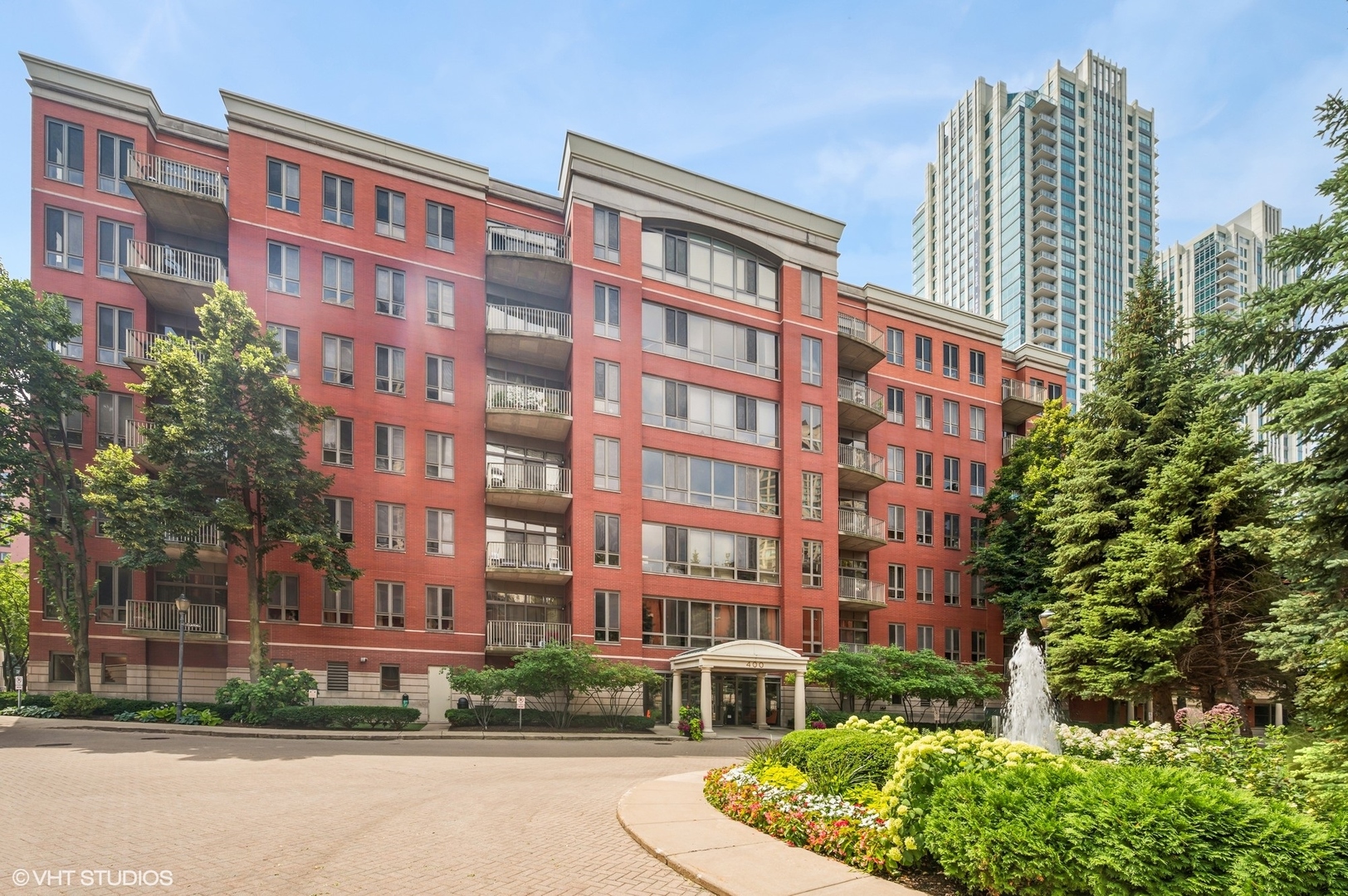 Welcome to Kinzie Park, a serene and private riverfront community offering 24/7 gated entry security and door staff, an ideal blend of luxury, convenience, and tranquility in the heart of the city. This sun-filled southern penthouse in the boutique mid-rise features a desirable split two-bedroom, two-bath layout with oak hardwood floors and an open-concept living space that's perfect for entertaining. The kitchen shines with stainless steel appliances, shaker maple cabinetry, and a breakfast bar with counter seating, seamlessly connecting to the living area where a cozy wood-burning fireplace (which only this floor offers), surround sound throughout the living room, and a south-facing balcony provide warmth, charm, and all-day sunlight with gorgeous city views. The oversized 17' x 12' primary suite is a true retreat, complete with a spacious walk-in closet and an en-suite bath featuring a walk-in shower and generous storage. Additional highlights include abundant storage throughout the home, an attached heated indoor garage parking space, and a private storage locker. Kinzie Park residents enjoy a truly unmatched lifestyle, with amenities including an updated fitness center, outdoor pool, private dog walk, party room, beautifully landscaped private parks and seating areas, and direct access to the exclusive Riverwalk. The community's 6.5 acres of lush gardens, fountains, and walking paths create a peaceful urban oasis, complete with unlimited free guest parking and 24-hour security. Ideally located just steps from Fulton Market, the Chicago Riverwalk, the Loop, and the renowned East Bank Club, this home also places you within walking distance of Chicago's best dining and nightlife-including Gibsons Italia, Alla Vita, Avec, Piccolo Sogno, La Scarola, Bavette's, Gene & Georgetti, Prime & Provisions, Cupitol Coffee, and more. Whether you're strolling along the riverwalk, enjoying the fountains and green spaces, or hosting friends in this vibrant community, you'll love the quiet luxury of one of downtown's only gated enclaves. 25K deeded garage parking space sold separately.