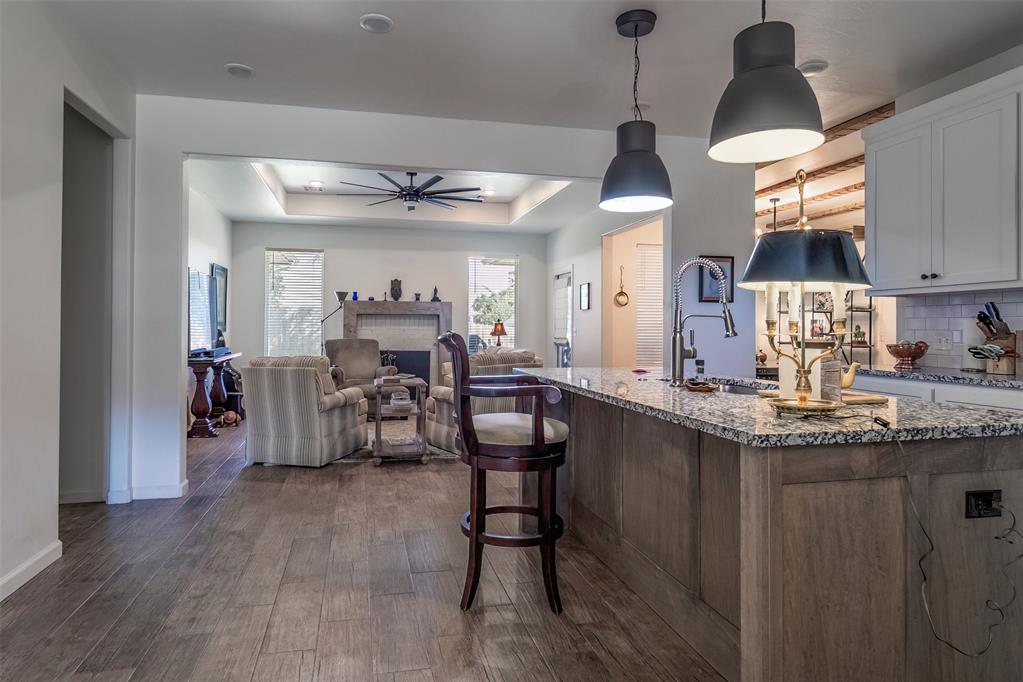 Wow, Wait until you see this Incredible home! This Kitchen is a culinary lover's dream with sparkling stainless steel appliances that include a new Forno Gas Range with built in Air Fryer, Refrigerator, Dishwasher & Beverage Cooler all handy right by your roomy walk in pantry. This amazing open and entertaining kitchen with large eat around island is also open to your beautiful living room with gas fireplace, beautiful mantle and a massive amazing ceiling fan. The openness continues to the dining room with more amazing custom features such as box car beams on the ceiling and a beautiful sliding barn door for privacy to the back bedrooms & bath. The 4th bedroom has a full bath and is currently being used as a study that is separate from the other 2 bedrooms. You pass a beautiful custom wood inlaid niche as you're moving down the hall to your private Primary suite, which is a great in-law plan, as well as including but not limited to a gorgeous spa like bath with large tub and oversized walk-in shower and large walk in closet! This home has it All plus a stunning large backyard with a covered patio to enjoy wonderful privacy and plenty of relaxing, serene moments! Better Hurry, you Don't want to miss this stunning home!