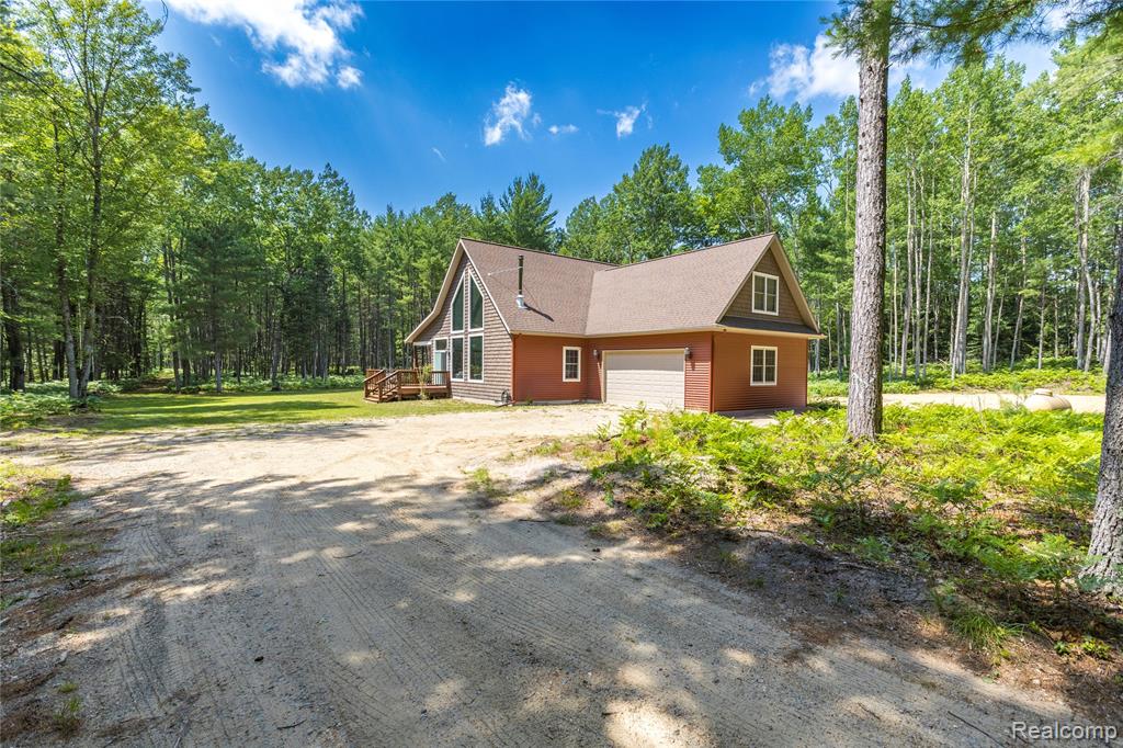 Welcome to your secluded paradise nestled on a pristine 10-acre wooded lot with shared private access to the tranquil waters of Lake St. Helen. This meticulously crafted build, completed in 2018, presents a rare opportunity to own a stunning retreat where luxury meets natural beauty. Upon entering this gorgeous 2-bedroom, 2-bathroom home, you'll be greeted by an immense main bathroom featuring a walk-in custom tiled shower, perfect for unwinding after a day of outdoor adventures. The spacious loft offers versatility and panoramic views of the surrounding woods. The heart of the home lies in the great room, adorned with floor-to-ceiling windows that invite abundant natural light and picturesque vistas of the wooded paradise outside. Whether you're savoring morning coffee or entertaining guests, this inviting space provides the ideal backdrop for every occasion. Embrace the serenity of your own 10 acres, where privacy abounds yet convenience is never far away with shared private access to Lake St. Helen just a short distance down the road. Spend your days indulging in a myriad of recreational activities, from boating and fishing on the lake to exploring the renowned St. Helen area ORV trail system. Don't miss out on this exceptional opportunity to own a slice of paradise where luxury, privacy, and outdoor adventure converge.  The home also has a water sprinkler system that gets winterized yearly.  Schedule your showing today and make this dream retreat your reality!