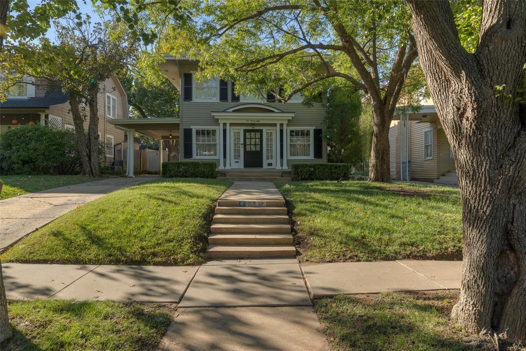 Built circa 1920, this classic American Foursquare, a style also known as a “Prairie Box,” pairs the strong symmetry and proportions of the period with a dash of Colonial spirit. Symmetrical porch columns, 12-panel sidelights, an arched door pediment, and classic shutters give character to the exterior, while distinctive original wavy glass appears throughout the home.The main level offers two living areas, two dining areas, and a renovated kitchen with breakfast bar. At the rear of the house, the second living area opens through three sets of doors to a patio beneath a quintessentially classic pergola, creating a natural extension of the interior. Immediately beyond the family room is the recently renovated pool and hot tub, with a full two-car garage and ground-level guest quarters completing the property. The guest quarters boasts an open living and sleeping space, kitchenette, oversized full bath, and generous closet.Upstairs, the renovated primary suite is complemented by three additional bedrooms, a study or family lounge, laundry, and a second full bath with double vanities. Four bedrooms, an additional lounge or study, and upstairs laundry provide the kind of functionality rarely found in a home of this era.The location captures so much of what makes Heritage Hills one of Oklahoma City’s most beloved neighborhoods. Situated in the city’s oldest historic preservation district, the home is less than one block from Wilson Elementary, an arts integration school, and just two blocks from the Uptown 23rd District. Tree-lined streets, greenspaces, neighborhood events, front porches, and a steady rhythm of people walking and gathering give Heritage Hills a sense of community that is increasingly hard to find.