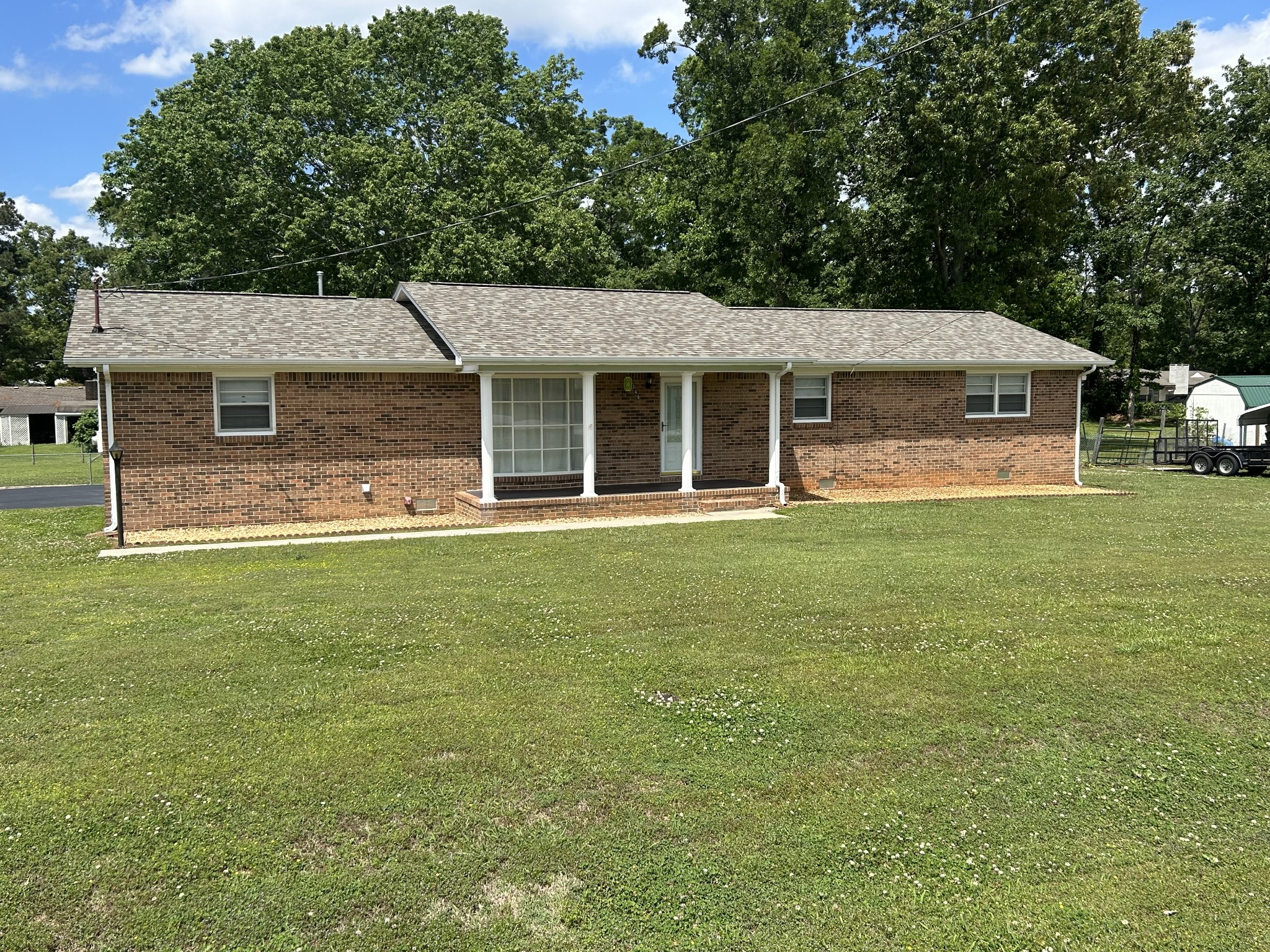 Move-in ready and full of updates! This 3-bedroom, 2 bath all-brick home offers approximately 1,400 square feet with a new roof in 2024 plus HVAC less than 5 years old. Located in the city limits with the convenience of natural gas and sewer. Enjoy a quiet neighborhood, shaded fenced backyard, attached garage, carport, storage shed, paved drive and oak cabinets.