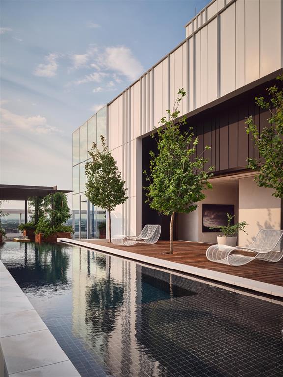 It is a home unlike any other. Atop HALL Arts Penthouse brings together architecture, interiors, art and landscape in a singular expression of contemporary Dallas living. Designed by the renowned Abeyta Architecture Studio and crafted by Allgood Pfannenstiel, the residence occupies the top of the 28-story tower, where warm woods, sculptural forms, refined metals and tactile materials create spaces that feel sophisticated yet remarkably livable. The interiors add another layer to the story. New York–based Neal Thomas Enterprises staged the residence’s furnishings, curating distinctive pieces that complement the architecture rather than compete with it. Here, Thomas brilliantly demonstrates how the interiors can feel less decorated than collected over time. Natural light is part of the design itself. Expansive glass frames the Dallas skyline, while the home’s restrained material palette shifts subtly throughout the day — everywhere from the intimate dining area to the serene primary suite. The architecture reaches its most dramatic expression outdoors. An expansive terrace by award-winning landscape architecture firm Hocker extends the residence into the sky, with a private swimming pool, trellis-covered lounge and sleek firepit — all making for an unexpected urban oasis above the city. Beyond the residence, homeowners enjoy the services and amenities of HALL Arts Residences, including 24-7 valet and concierge, house car, wine-focused dining room, fitness center, alfresco putting green and access to the adjacent HALL Arts Hotel — all within the Dallas Arts District and the Texas Stock Exchange.