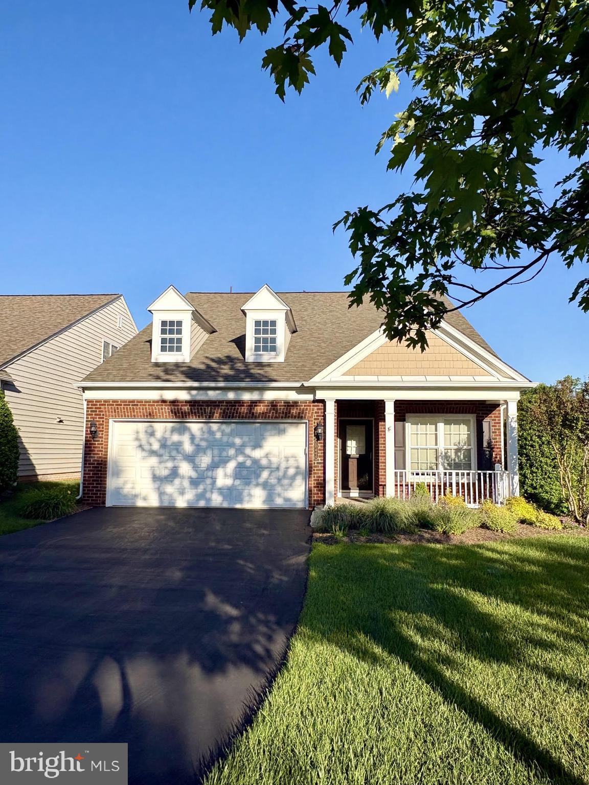 Welcome to this beautifully maintained brick-front single family home in the sought-after gated 55+ community of Potomac Green! Offering 3 bedrooms, 3 full baths, and a thoughtfully designed floor plan, this home combines comfort, functionality, and style.A charming flagstone walkway (put in 2024) and front porch create an inviting first impression, with added privacy thanks to the space between neighboring homes. Inside, you’ll find spacious living and dining areas, along with a dedicated office on the main level—perfect for working from home or pursuing hobbies.  Next to the 2 story, spacious family room, is the well-appointed kitchen features stainless steel appliances, a double oven, cooktop, built-in microwave, and a raised center island with seating.  The spacious primary suite offers a relaxing retreat with a beautifully upgraded bath featuring dual vanities, granite countertops, upgraded tilework, and a walk-in shower. A second main level bedroom is located adjacent to a full bath with granite counters and upgraded tile finishes.  Convenient main-level laundry adds everyday ease.Upstairs, enjoy a versatile loft area, a generously sized third bedroom with an attached full bath showcasing upgraded tile and granite finishes, and a large storage room.Step outside to the rear yard featuring a paver patio, impressive pergola, and beautiful landscaping with flower beds—perfect for outdoor entertaining or relaxing.Additional updates and features include an epoxy-coated garage floor with added shelving, newer Andersen windows replaced in stages, a newer hot water heater (2025), newer washer, a recently resurfaced driveway (2024), and a well-maintained HVAC system.Residents of Potomac Green enjoy exceptional resort-style amenities including a clubhouse, fitness center, swimming pool, tennis courts, game room, library, picnic areas, and numerous social activities.Ideally located near shopping, dining, and entertainment, including One Loudoun, Dulles Town Center, Bles Park, Routes 7 and 28, and Dulles International Airport. This is active adult living at its finest!