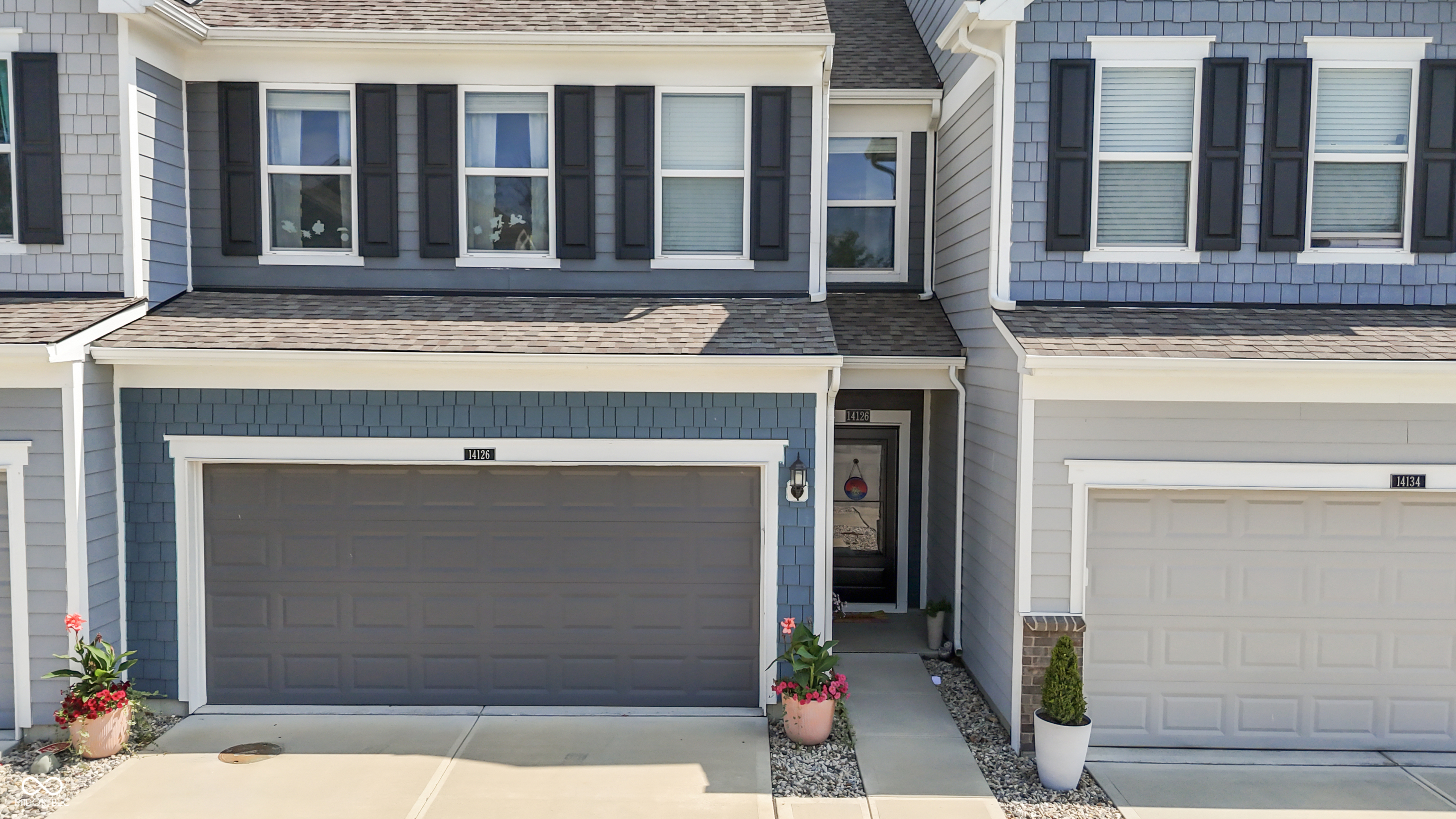 Welcome to this warm, welcoming like-new townhome just minutes to Hamilton Town Center, Fishers District and Nickel Plate District, shopping, restaurants, amenities, and easy interstate access. This open and bright 3 bedroom, 2.5 bath home has quartz countertops, stainless steel appliances, a gas cooktop, and a private and peaceful setting with no other units behind it. Meaningful builder updates include vinyl hardwood continuation throughout main level, built-in lockers adjacent to garage, and expansive full tiled primary shower. Current seller has added chair rail trim and new earth-tone paint throughout, custom mirror frames in bathrooms, new pendants over kitchen island and new cabinet pulls, faucets and garbage disposal, blinds on all windows, new storm door, and new shower heads, and a Murphy bed to the third bedroom. Rooms all have generous closets, and the mudroom built ins and garage ceiling rack provide additional storage. All appliances remain, including washer, dryer and water softener. The Towns at Avalon North neighborhood has a dog park and also has access to Avalon of Fishers amenities, which include multiple pools, playground, trails, clubhouse, basketball, and tennis.