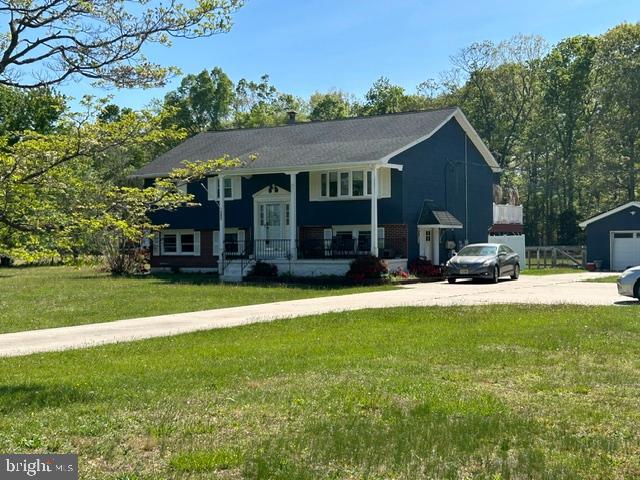 MOVING - Get Ready to Move-IN to this Amazing Home with plenty of room for rest and play.   Step forward - You will definitely Love This Home!   Comfortably UPDATED and Roomy **  2384 ** sq ft home with detached garage, fenced yard and Solar (save on electric) - Rural Community on nearly two acres of comfortable and country life.   Updated kitchen with granite countertops, Newer Flooring Throughout "No carpet", (wood, ceramic tile and laminate flooring).  Updated windows throughout, and fully finished lower level. Fourth bedroom is on lower level with access to full bathroom on lower level.   Family room has Harmon pellet stove for cozy evenings.  Extra Large office, game room or family play area, you decide the uses!!! Plenty of doorways to enjoy outside living.   Large Rear deck is great for family entertaining and can be accessed from Primary suite and Dining area.  Lower level has two access areas - one to parking area and one to the backyard.  Nice Setback from road with minimal noise and close, but private.    Also detached garage for car or storage.  Start living the country life with convenience to shopping, major highways and, if you have or want pets, they will love it here with fenced yard.   Great decisions start with buying a home that will fill all your needs, with space, lower living expense (solar panels) and a great location!!!