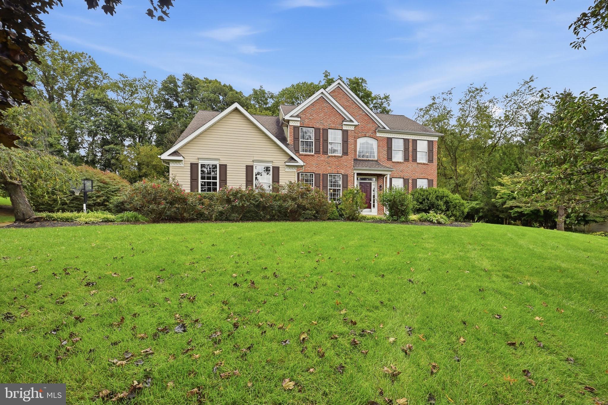 If you want a home that gives you space, tranquility, and privacy, yet still feels close it all - you've found it. This is 501 Falcon Dr, a stately and classic brick-front Colonial with an open concept floor plan. Situated only a few minutes from downtown Kennett Square, this four bedroom home is situated on an acre of land, adjacent to preserved space, which preserves your beautiful backyard views for years to come. On your tour, you'll step inside to find a dining room on your left, and sitting room on your right. Follow the beautiful hardwood floors back, and you'll find a dedicated office area. This home features a soaring two-story foyer, and family room with a gas fireplace . Next to the family room is the eat-in kitchen, which features beautiful white cabinets, granite countertops, and a full dining space. On the first floor you'll also find a powder room, dedicated laundry area and two car garage. Upstairs, the large primary bedroom is sure to impress, with tray ceilings, two large walk-in closets, and a stylish, fully updated primary bathroom (2024) with glass enclosed shower and soaking tub. Your own spa retreat! The hall bathroom upstairs was also fully renovated in 2024. 3 more well-sized bedrooms complete the upstairs. This home is freshly painted and clean; well maintained and move-in ready, yet still remains opportunity for you to make it your own. For more peace of mind, other notable updates include new roof (2018), new HVAC (2022), and re-paved driveway (2023). This neighborhood, Falcons Lair, is in the award-winning Kennett Consolidated School District with a brand new elementary school. Falcon's Lair is walking distance to Kennett Greenway trails which can take you all through the Township and Borough, not to mention the many other local parks and greenspaces! Close to dining, shops, highways, and anything else you need. Come discover how much you will love living here!