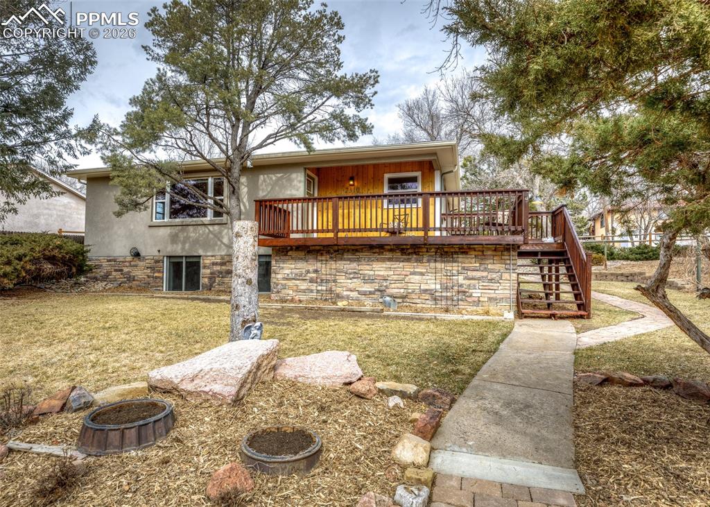 Pride of ownership shows in this 4 Bedroom, 2 Bathroom Ranch Style Home on the Westside of Colorado Springs, just to the North of Thorndale Park. The main level features two bedrooms, a large living room and an eat-in kitchen with a walk-out to the large composite deck.  The kitchen has been recently remodeled and offers new cabinets, a large pantry, solid surface countertops, tile floor and stainless steel appliances. As you head downstairs you are greeted with a bright and open family room space, a nook just off of the family room which is a perfect office space or craft area, two additional bedrooms and a 3/4 bathroom with laundry area.  The downstairs has new carpet, and large egress windows providing ample lighting to the downstairs area. The outdoor spaces offer mountain views from the large front deck and a peaceful backyard retreat with a pond and natural landscaping. Off-street parking is accessible off the alley with plenty of space to add a detached garage or possibly an auxiliary living unit in the future. White and Red Oak Floors throughout the Main Level, New Interior Paint and New Carpet in the Downstairs. A New Furnace and A/C was installed in 2021 along with a New Electrical Panel. Don't Miss Out! Schedule your Showing Today!