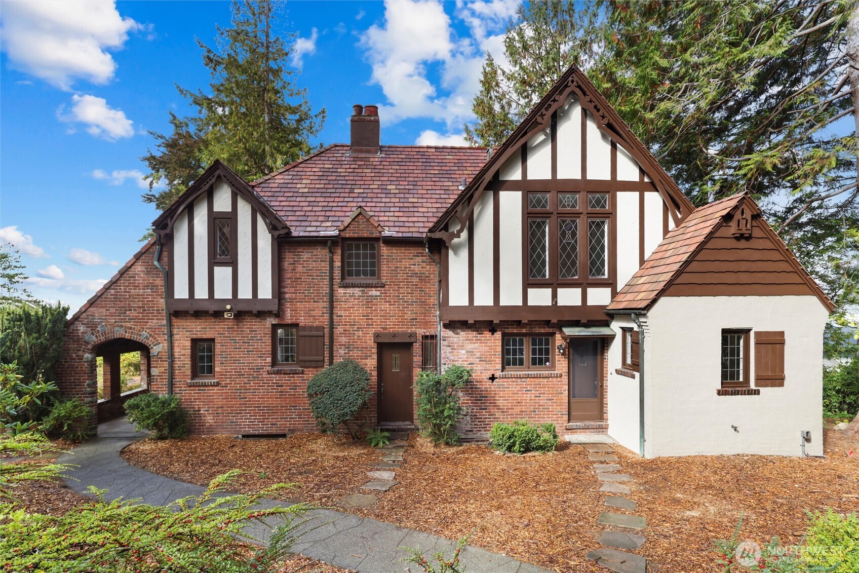 This coastal LEGACY home in Three Tree Point offers a serene Puget Sound view and timeless Northwest charm. Leaded and stained glass windows and the dining room’s built-ins add character, while the fireplace, tile roof and architectural details celebrate the home’s history and elegance. French doors open to a patio overlooking the Sound, perfect for morning coffee or sunset cocktails, with potential for beautiful landscaping. Each bedroom w/ en-suite bath, and the lower level offers opportunity for additional living or creative space. Steps from the beach and historic Indian Trail, this RARE untouched home blends elegance and the fun, relaxed lifestyle of 3TP, while remaining close to freeways and SeaTac Airport but out of the flight path.