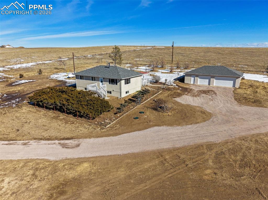 Country living at it's best !!! This charming, completely remodeled raised Rancher with a finished basement sits over 7 acres of land, zoned for 2 or more horses, just minutes away from all city amenties, offering a rare blend of country charm with modern upgrades, approximately 15 minutes from all the conveniences the Powers Corridor has to offer for shopping, dining, and everyday essentials, featuring a brand new septic system, newer roof, new water heater, new furnace and brand new interior, new kitchen and appliances, and all new bathrooms, original hardwood floors on main level, this home truly offers the best of country living with quick access to Schriever AFB, Peterson SFB, and Fort Carson.