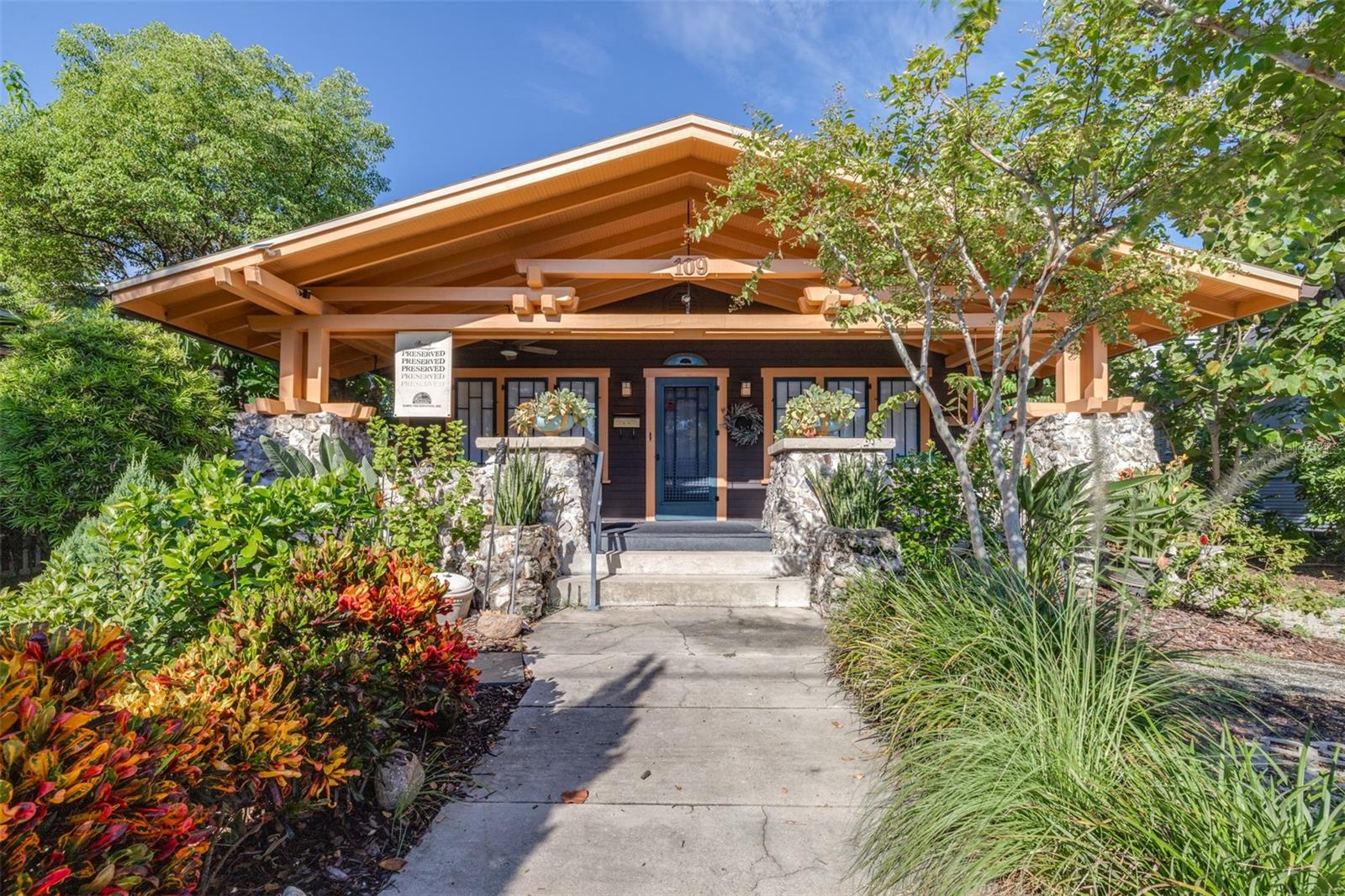 Under contract-accepting backup offers. Make this pristine 1922 Craftsman Historical Bungalow in the sought-after Hyde Park neighborhood your next home. This truly unique property is an oasis in the city, with a main house offering 3 bedrooms, 2 bathrooms, and endless charm. Rarely found at this price point in Hyde Park, it includes a separate detached in-law suite or potential rental apartment with a kitchen, living room, bedroom, and bathroom above a workshop, laundry room, and storage space. A lush botanical garden surrounds the home, with a serene goldfish pond adding to the tranquility. Updates include a new electrical panel, a 6-year-old A/C, and a roof on the main house just 3 years old. Located on Westland Ave, one block from Howard Ave, in walking distance of shops, restaurants, Publix GreenWise, nightlife, and more. Motivated sellers have priced it to sell quickly—don’t miss this incredible opportunity to own a one-of-a-kind property in Hyde Park.
