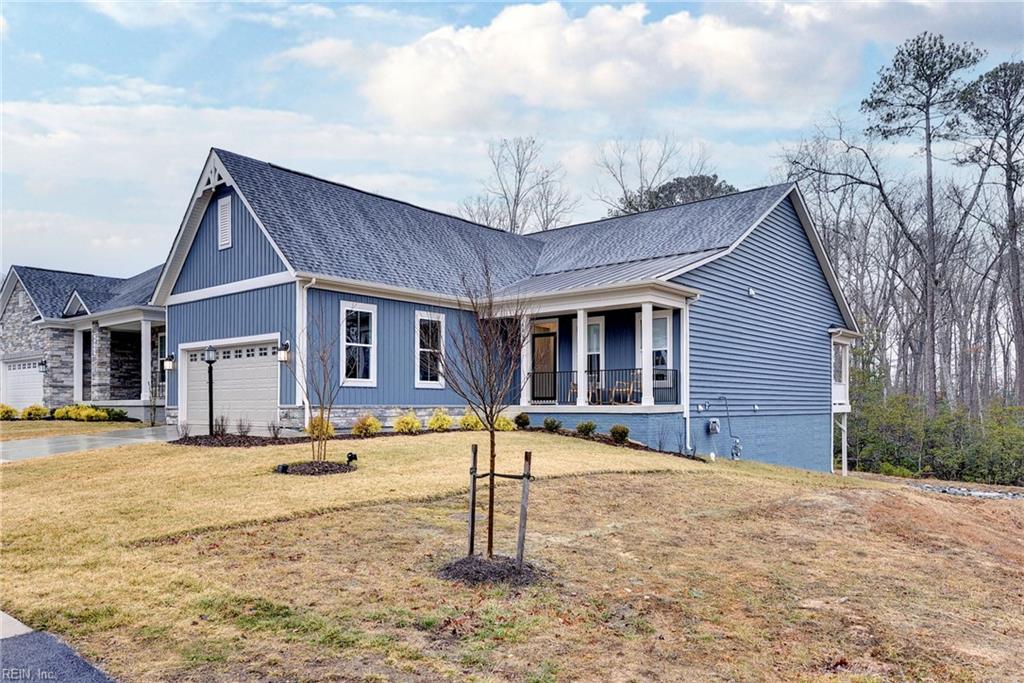 Do you love Williamsburg, but wish the homes were a little less "Burg" and a lot more "Wow"? Well, here's your opportunity to step into a virtually brand new, beautifully upgraded home, in Wbg's premiere resort-style 55+ community. Just 2-years old, the seller has transformed the interior of the home w/high-end finishes including fixtures, tile & cabinetry and audio visual equipment. You'll be impressed at every turn. Even the furniture was chosen for its design & scale to complete the look, & it can be included in the purchase. Stunning James model w/ finished walk-out LL sits on premium lot backing to woods w/no neighbors to the right. Primary ste, guest rom, flex rm & covered rear porch all sit on the main floor. Below, the full-height, drywall finished basement features a huge addl guest suite, full BA, lg media or recreational space. Plumbed for a wet bar w/design in process. And there's unfinished storage for your extra stuff. Like what you see? We can talk about a turnkey price.