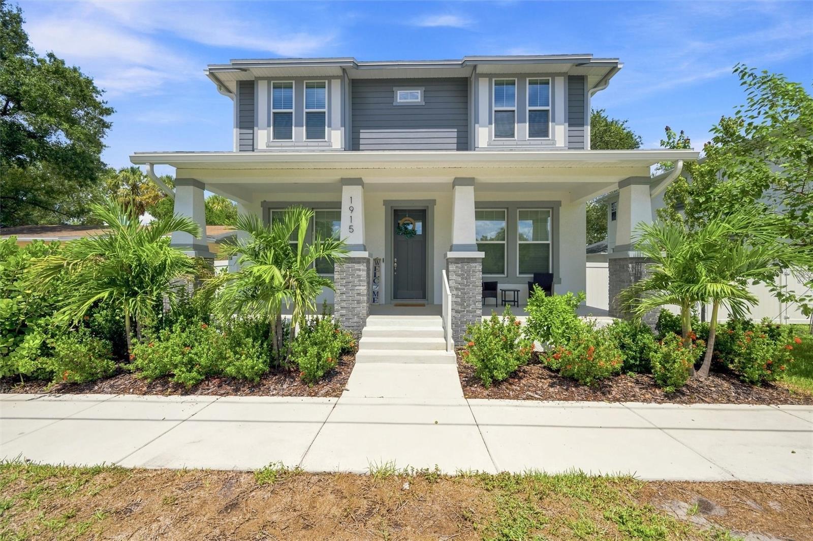 Virtually Staged. Built in 2024 and ideally located in North Hyde Park, this impressive 5-bedroom, 3-bath Craftsman offers approximately 2,400 square feet of thoughtfully designed living space in one of Tampa’s most desirable in-town neighborhoods. With a detached, air-conditioned two-car garage, NO HOA and NOT in a flood zone, this nearly new home offers the benefits of newer construction in a location close to everything that the beautiful city of Tampa has to offer.Inside, the home features a bright, open layout with engineered hardwood flooring, high ceilings and a comfortable flow between the kitchen, dining and living areas. The kitchen serves as the centerpiece of the main living space with stone countertops, a large center island, generous cabinetry and a walk-in pantry, making it equally suited for everyday living and entertaining.A first-floor bedroom and full bathroom provide valuable flexibility for guests, multigenerational living or anyone who prefers a bedroom and bath without stairs.Upstairs, the spacious primary suite offers a private retreat with a walk-in closet, dual vanities and an oversized walk-in shower. Three additional bedrooms complete the second floor, providing plenty of options for guest rooms, a home office, nursery, media room or fitness space while maintaining a true five-bedroom floor plan.Outside, the extended rear patio and fully fenced backyard create a private and functional outdoor living space for entertaining, dining, pets or simply relaxing. A wide covered front porch adds classic Craftsman character, while hurricane shutters, irrigation, rain gutters and energy-efficient windows add everyday convenience and practicality.The location is a major part of what sets this home apart. Walk to the new Rome Collective and enjoy the continued growth of dining, coffee and lifestyle destinations throughout North Hyde Park. Hyde Park Village, Oxford Exchange, Downtown Tampa, the Riverwalk, SoHo, Armature Works, shopping, dining and entertainment are all just minutes away.Five bedrooms, three full baths, 2024 construction, a first-floor bedroom and bath, extended rear patio, fully fenced backyard, air-conditioned detached two-car garage, NO HOA and NOT in a flood zone. A rare opportunity to own a nearly new home with exceptional space and flexibility in one of Tampa’s most connected in-town locations.