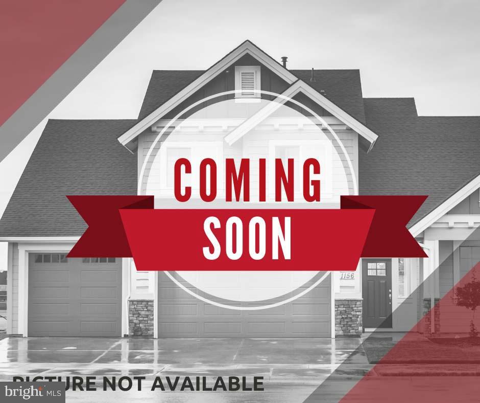 Come check out this townhome featuring a desirable open concept floor plan and numerous upgrades throughout. The upscale kitchen boasts a spacious center island, granite countertops, and stainless steel appliances, making it perfect for entertaining and everyday living. Enjoy hardwood floors throughout the entire main level and durable luxury vinyl plank flooring on the lower level. The family room flows seamlessly into the kitchen and dining area and all offer easy access to the deck overlooking trees, providing a peaceful outdoor retreat. Additional highlights include an upgraded washer and dryer, ample parking with additional spaces conveniently located across the street, and a well maintained interior and exterior that shows pride of ownership throughout.  Ideally situated in a prime commuter location with quick access to the Metro, airport, major routes, shopping, dining, and community amenities. Location, location, location—this exceptional townhome combines comfort, convenience, and style in one outstanding package.