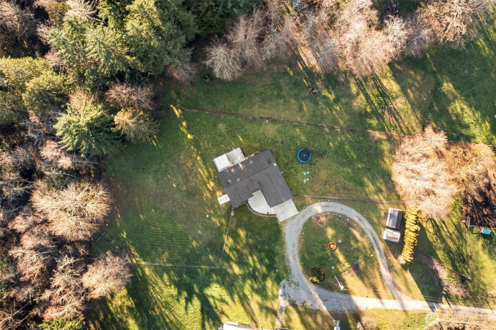 Quiet country mornings, open space, and modern comfort—this 2020-built rambler on 1.255 acres delivers it all, just minutes from JBLM East Gate. Light-filled and move-in ready, the thoughtfully designed open-concept layout features granite countertops, stainless steel appliances, and a large island with eating bar, plus a dining area ideal for entertaining.    The spacious primary suite offers a private 5-piece ensuite bath and walk-in closet. Two additional bedrooms are positioned on the opposite side of the home for added privacy, along with a full guest bath. Heat pump keeps you cool on those hot summer days. Wired for generator use. Outdoor living shines with a front patio and firepit, a fully fenced backyard and patio perfect for BBQs, pets, and play, and two storage sheds ideal for toys, tools, or gardening supplies. Peaceful country living with easy access to major commuting routes.