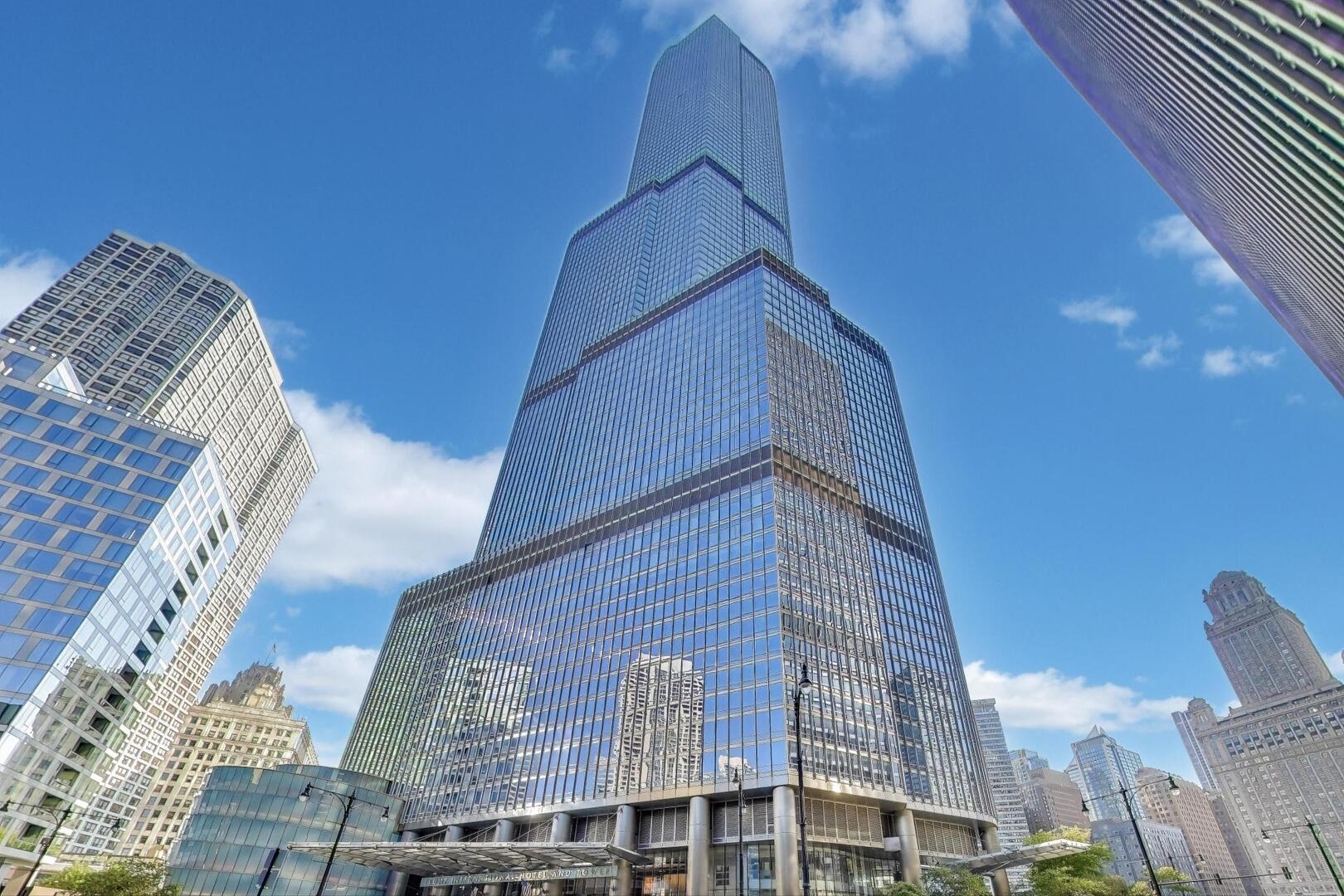 Step inside this distinctive penthouse-like resdience through an immersive virtual 3D tour. Located on the 68th floor of the Trump Tower, this spectacular home defines luxury living with breathtaking panoramic views and impeccable design. Created by world-renowned architect Adrian Smith, this turn-key, fully furnished home spans approximately 3,100 square feet, offering 3 ensuite bedrooms plus a den and 3.1 baths of refined sophistication. Expansive floor-to-ceiling windows showcase unobstructed north, east, south, and west exposures, revealing stunning vistas of Lake Michigan, the Chicago River, and the city skyline. The grand living and dining spaces feature soaring ceilings, two fireplaces with marble surround, and motorized shades, blending modern elegance with comfort and functionality. The state-of-the-art kitchen is equipped with Miele, SubZero, and Wolf appliances, sleek custom cabinetry, and an oversized island ideal for both entertaining and daily living. The primary suite serves as a luxurious retreat with a fireplace, dual custom built walk-in closets, and a spa-inspired bath complete with dual vanities, a soaking tub, and a separate glass-enclosed shower. Every element of this residence reflects careful attention to detail, from curated furnishings to premium finishes throughout. Residents enjoy access to 5-star hotel amenities, including a 14,000 sq. ft. world-class spa and health club, indoor pool, fitness center, 24-hour concierge and door staff, Terrace 16 restaurant, and a private dog walk. A tandem parking space is included, with additional parking available for purchase. Experience Trump Tower Chicago, where architectural brilliance, five-star service, and unmatched views combine to create one of the city's most exclusive residences.