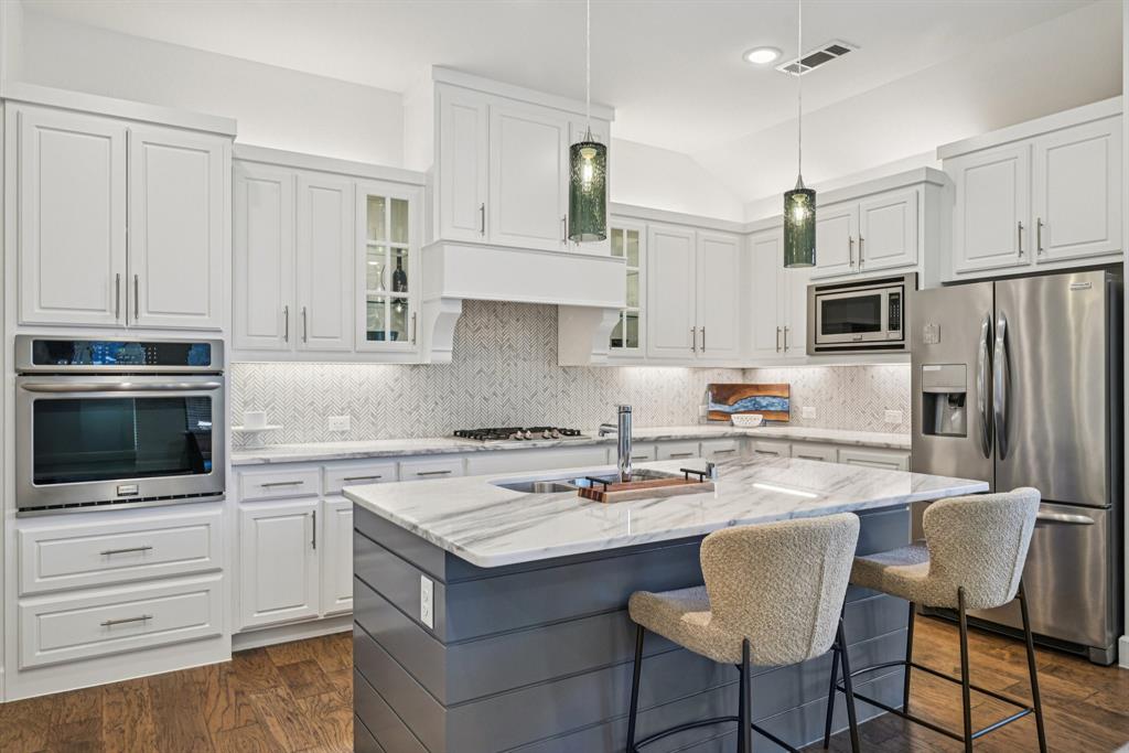 Rare One-Story Gem in Sought-After Twin Creeks! Discover this beautifully maintained single-story home offering 3 bedrooms plus a dedicated study, perfectly designed for modern living. The charming stone elevation and stamped-stained driveway create standout curb appeal, while the custom iron front door sets the tone for the elegant interior. The gourmet kitchen is a chef’s dream—featuring quartz countertops, stainless steel appliances, a gas cooktop, decorative lighting, an abundance of cabinetry, and a spacious pantry. The open-concept layout seamlessly connects the kitchen, dining, and family room—ideal for everyday living and entertaining alike. Retreat to the serene primary suite, complete with a spa-inspired bath showcasing an oversized walk-in shower and a dream closet. Enjoy outdoor living with a large covered patio and let the kids roam with a large yard. Front yard maintenance included in HOA. Amazing neighborhood amenities includes a clubhouse with office space, large kitchen, dining and entertaining area, outdoor kitchen, large pool, and state of the art fitness center. Scenic wooded hike & bike trails. Freshly painted interior, Cat 6 wiring and epoxy garage floor .