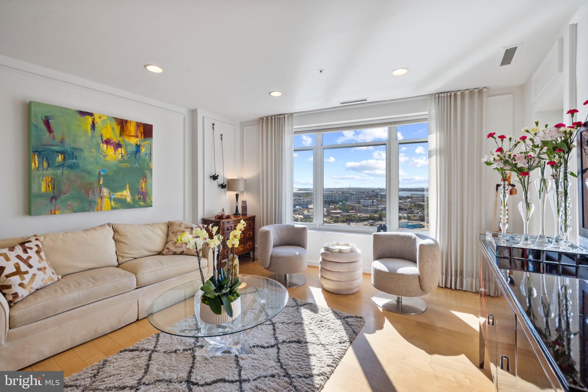 Unit 1708 - a sophisticated 17th floor condominium features approximately 1,138 square feet of living space enhanced by spectacular views of the Baltimore Harbor. This home offers an open floor plan with a spacious living/dining room combo, a private one bedroom ensuite, and a separate powder room. The primary bedroom is spacious and well-appointed with extensive, mirrored built-ins for added storage and convenience. Two gated garage parking spaces convey.The living/dining room combo affords great entertaining and daily living with beautiful custom built-ins and easy access to the private outdoor deck. A sun-drenched unit boasts large windows throughout the home that highlight spectacular views of the Domino Sugars sign, the cruise ship terminal, the outer harbor and thebuild site for the Key Bridge.Building amenities offer a gym with ellipticals, treadmills and free weights, an indoor pool, outdoor pool, party rooms with billiards and a cozy fireplace, as well as a 24/7 front desk - adding to the luxurious lifestyle the residents enjoy.Close proximity to major arteries - I-95, I-83, and to BWI Airport and AMTRAK stations makes for easy commuting.  And The Harborview Towers - located on the Inner Harbor Promenade - afford access to restaurants, shopping, and events as well as Ravens Stadium and Oriole Park.
