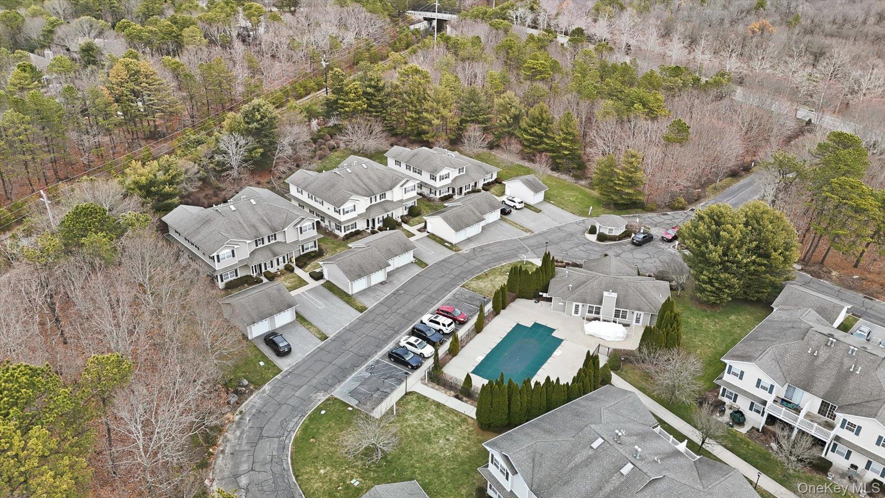 Well Appointed 2 Bedroom Upper End Condo located in the Gated Park-Like Setting of Eagles Walk Over 55 Community. The location is perfectly situated close to the Club House and the Heated Salt Water Pool! The interior features high ceilings and an open floor plan for the living room/dining room and kitchen! Your laundry room is conveniently right off the kitchen. As you travel down the hallway you will find a generously sized hall closet, your private temperature control, and your Guest Bedroom / Office featuring a private balcony. The Primary Bedroom boasts high ceilings, plenty of windows with woodsy views and two large closets– one of which is a walk- in. You will also find the en-suite full bath. Your garage features an attic for additional storage. This condo is perfect to enjoy all year round! From the picturesque changing of the leaves in the Fall, to relaxing by the community's heated salt water pool, to watching the East End transform into a Winter Wonderland, there's something for everyone! Southampton's premier beaches are just a short drive from your new home. Come experience the lifestyle that you have earned and deserve!