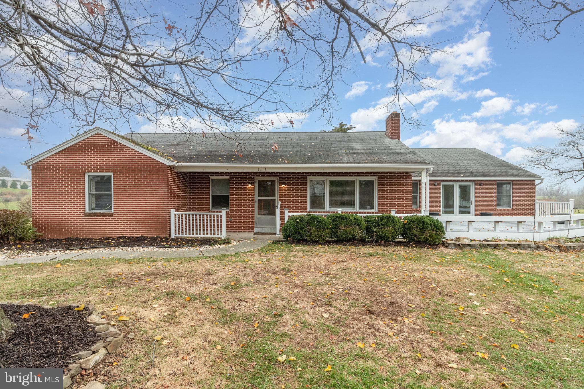 The Village of Linglestown original Family Homestead! Welcome to this sprawling custom-built brick ranch home with 4 Bedrooms, 3.5 Bathrooms, 3-car oversized garage and so Much More! Situated on a picturesque .67-acre lot in sought after Lower Paxton Township, Central Dauphin School District, this home has everything you desire and more. Originally built in 1953 with a major addition added in 2001, this charming Home filled with warmth & character offers excellent details including endless cathedral ceilings, large windows, and custom-built ins. The main floor includes wonderful places to gather including a welcoming living room accented by a brick fireplace, gleaming hardwood floors, picture window, and access to both a covered front porch and composite wood deck. Enjoy those special meals in the formal dining room with hardwood floors, custom-built-in corner cabinets and a door leading to the large walk-up attic. The light infused gourmet kitchen with breakfast room features cathedral ceilings, clerestory window, solid wood oak cabinets, gorgeous granite countertops, ceramic tile backsplash, center island with breakfast bar, triple basin stainless steel sink, full high end appliance package to remain with double ovens, gas and electric cooktops. This practical kitchen also offers a pantry, breakfast room with built-ins and a sliding glass door leading to a large composite wood deck, a pavilion with electric, your very own orchard with fruit trees, endless views and good times! The light and bright family room is distinguished by cathedral ceilings, recess lights, clerestory windows, guest powder room, and a sliding glass door leading to the front composite wood deck with built-in seating. The primary bedroom is equipped with cathedral ceilings, two mirrored double door closets, walk-in closet, and a door leading to the primary bathroom. The primary bathroom includes a walk-in/roll-in shower with a seat and ceramic tile surround, double basin vanity, and a large corner linen cabinet. Three additional generous size bedrooms, office and full Bathroom with a step-in shower complete the main floor layout. The walk-out basement offers endless possibilities with two large rooms currently being used as storage/workshop, a utility room, and a mud/laundry with utility sink, shower stall, commode, washer/dryer, storage cabinets, and a door leading to the beautiful rear yard and pavilion. Additional lower-level highlights include access to the heated 3-car oversized garage with openers, service door, and large paved driveway. This property provides excellent indoor/outdoor flow, and is conveniently located near schools, shopping, restaurants, and major highways. Please contact us to arrange a private tour and discover further surprises.