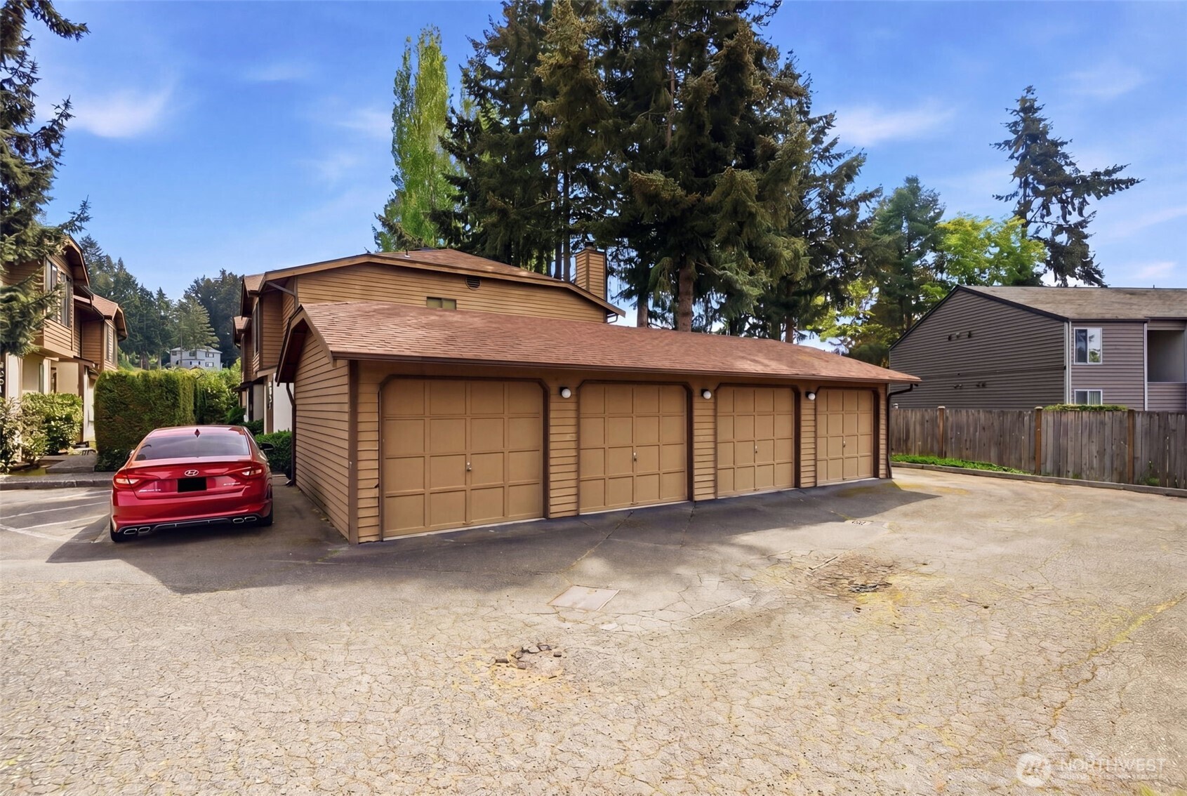 A must see! Welcome yourself home to this beautifully updated end-unit townhome in the desirable Evergreen community of Kenmore. Ideally located just minutes from I-405 and I-5, this home offers an easy commute to both Seattle and the Eastside while maintaining a quiet, tucked-away feel. Thoughtfully refreshed with new flooring, fresh interior paint, and brand-new carpet, the home is truly move-in ready and designed for comfortable everyday living. The functional layout features a bright and open main level, with a spacious living area that flows seamlessly to a private patio with yard space through sliding glass doors—perfect for morning coffee, gardening, pets, or simply relaxing in your own outdoor space. A convenient half bath on the main floor off the living room enhances livability for guests and day-to-day use. Ample kitchen space with bar seating adjacent to the dining nook. Upstairs, you’ll find two well-sized bedrooms and a full bath, offering separation of space and privacy. Dedicated single car detached garage for parking and an exterior storage closet for your day-to-day convenience. One of the best values in Kenmore, this is an incredible opportunity for first-time buyers, investors, or anyone looking to own in a strong Northshore School District location. HOA covers water, sewer, and garbage. A standout option you won't want to miss!